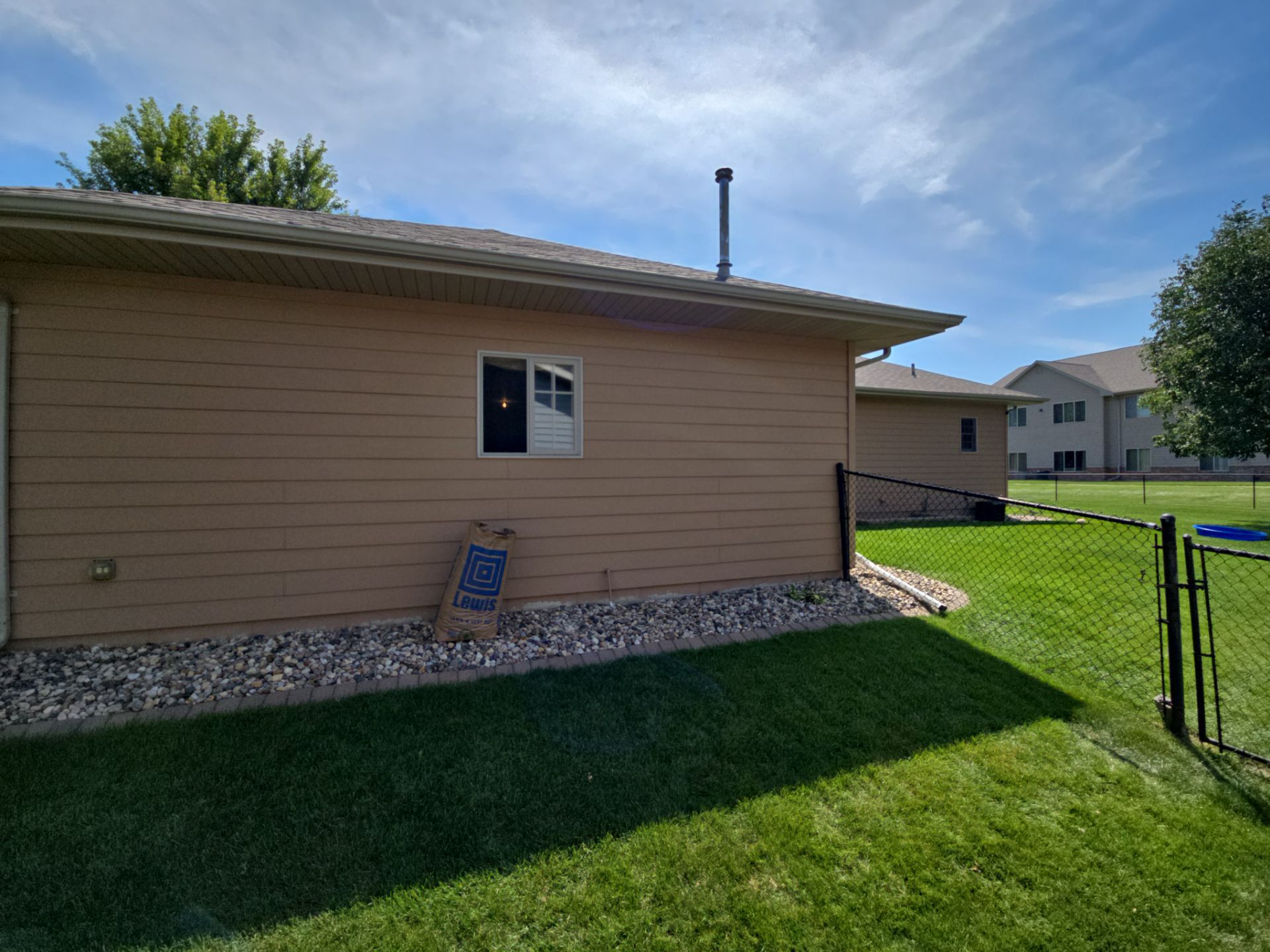 Sioux Falls Residential Exterior Door and Siding Refresh by Select Painting, Coatings & Garage Cabinets