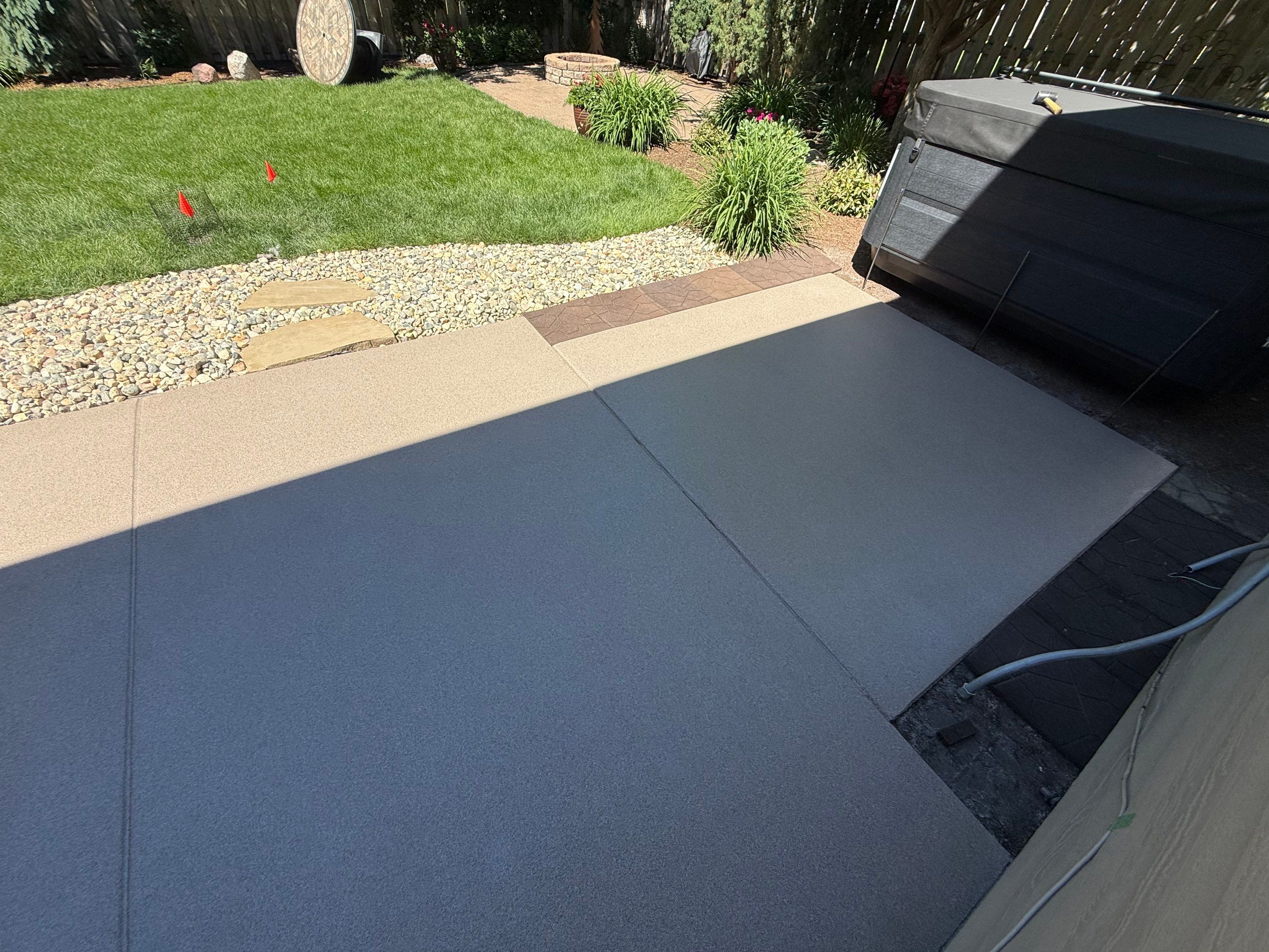 Textured Concrete Coating and Paver Patio Refresh in Sioux Falls by Select Painting, Coatings & Garage Cabinets