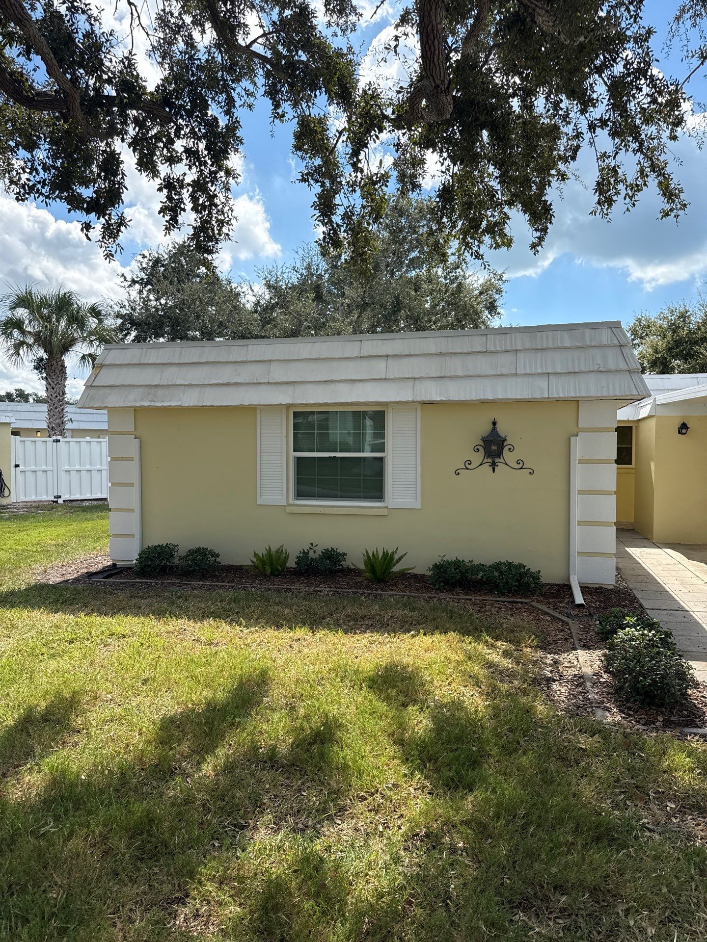 White Gutters and Matching Downspouts in Sarasota FL by Gutter Professors