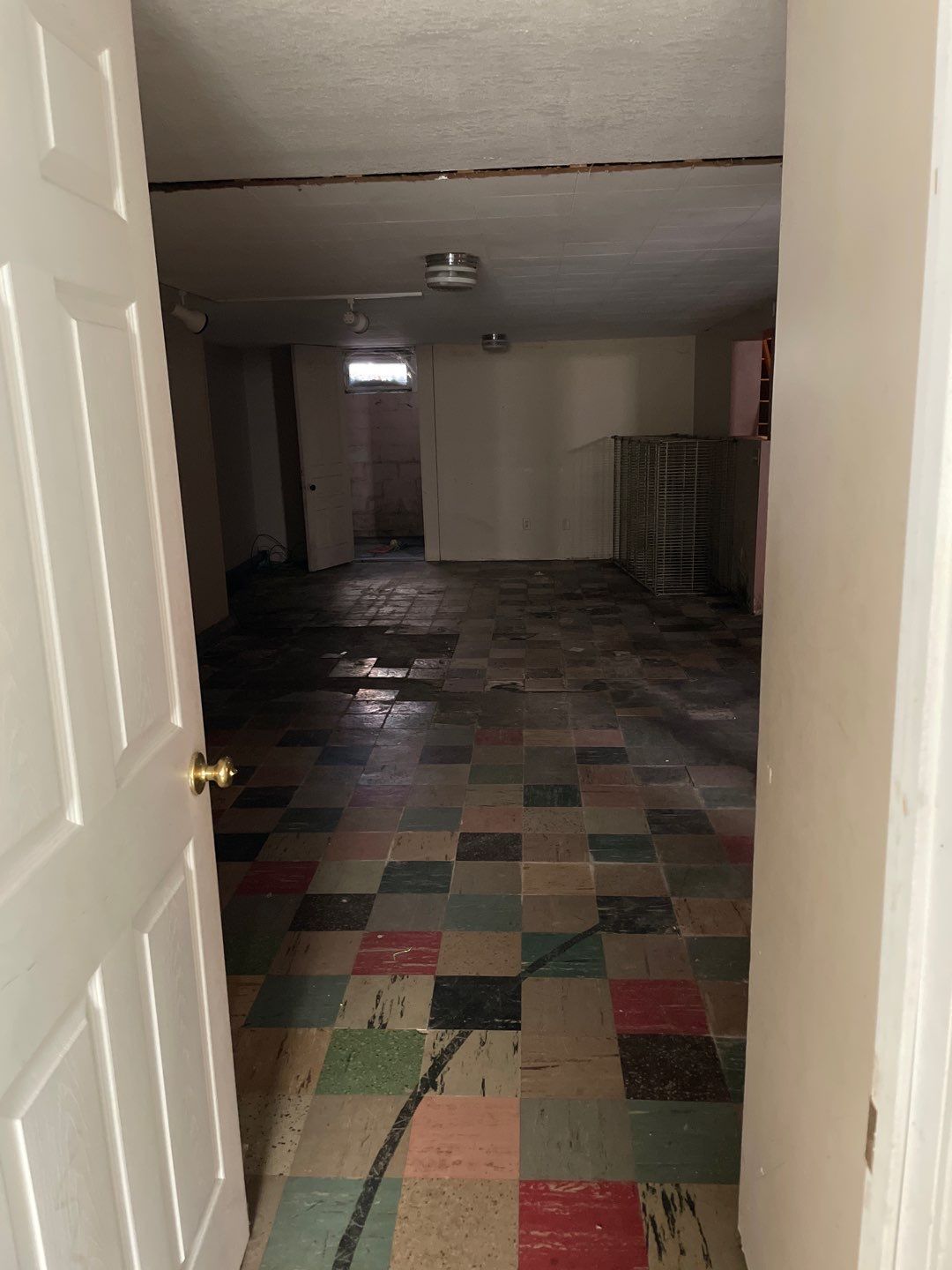 Interior drain tile system installation by ACE Waterproofing & Basement Solutions