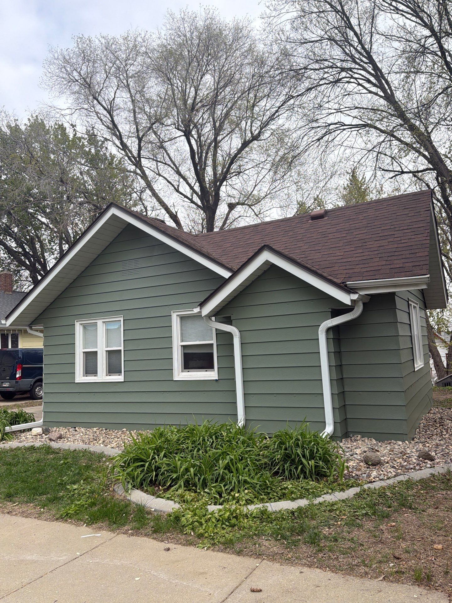 Exterior Siding Repair and Full House Repaint in Sioux Falls by Select Painting, Coatings & Garage Cabinets