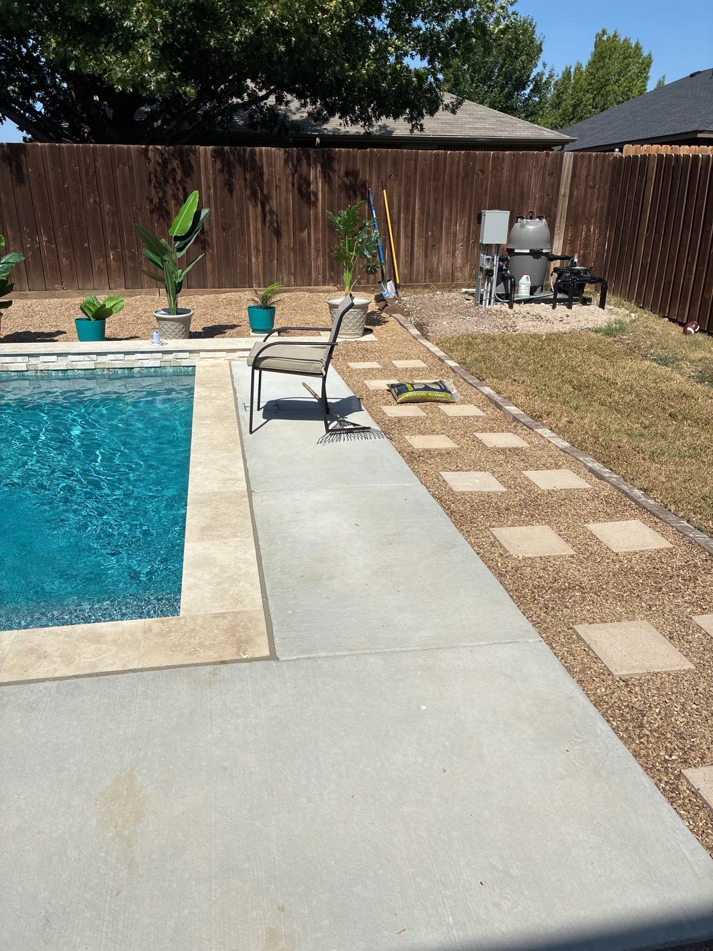 Modern Geometric Pool with Travertine Coping and Lush Landscaping by Pinnacle Pools and Spas - DFW