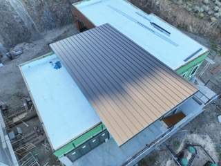 Dark Bronze Standing Seam by Reimagine Roofing