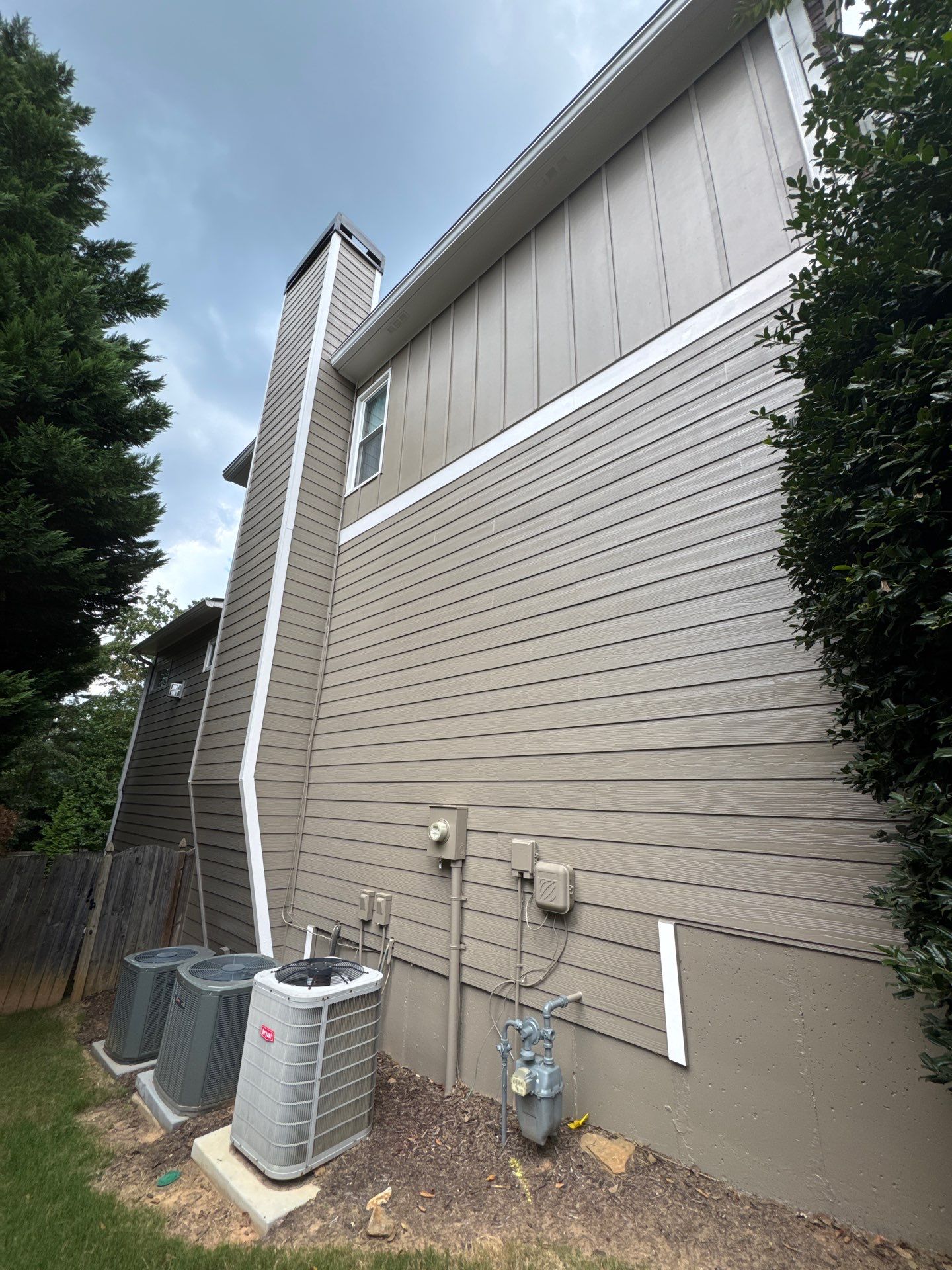 Exterior Modernization Featuring New Siding and Custom Wood Portico by Swift Home Renovations