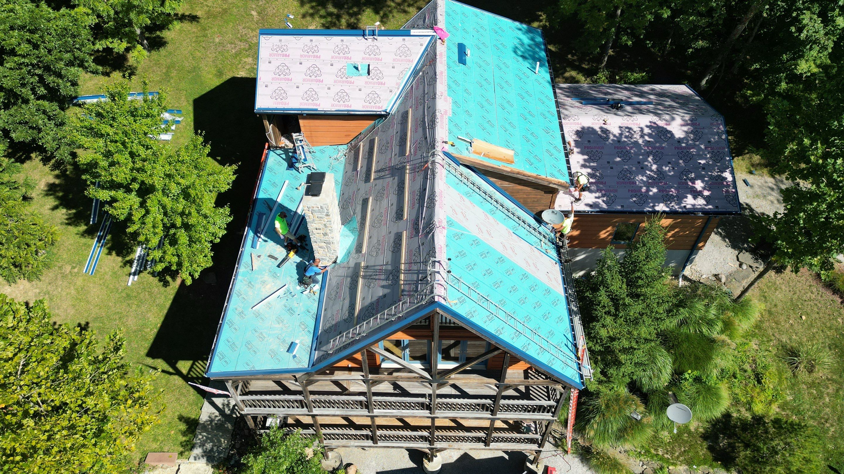 Residential Roofing Installation using Standing Seam Metal - Gallery Blue by RoofX 