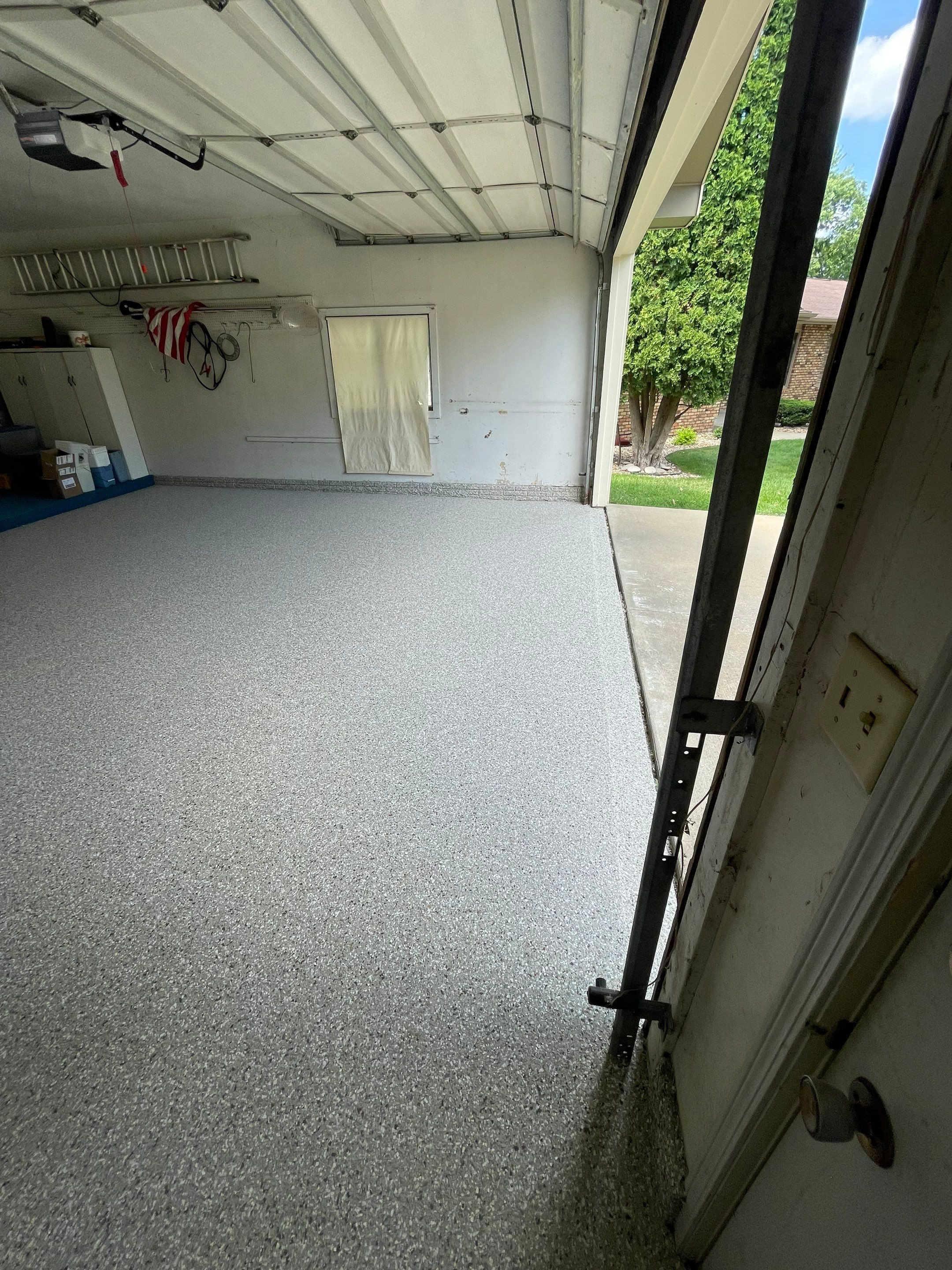 Custom Creekbed Garage Floor Coating in Sioux Falls by Select Painting, Coatings & Garage Cabinets