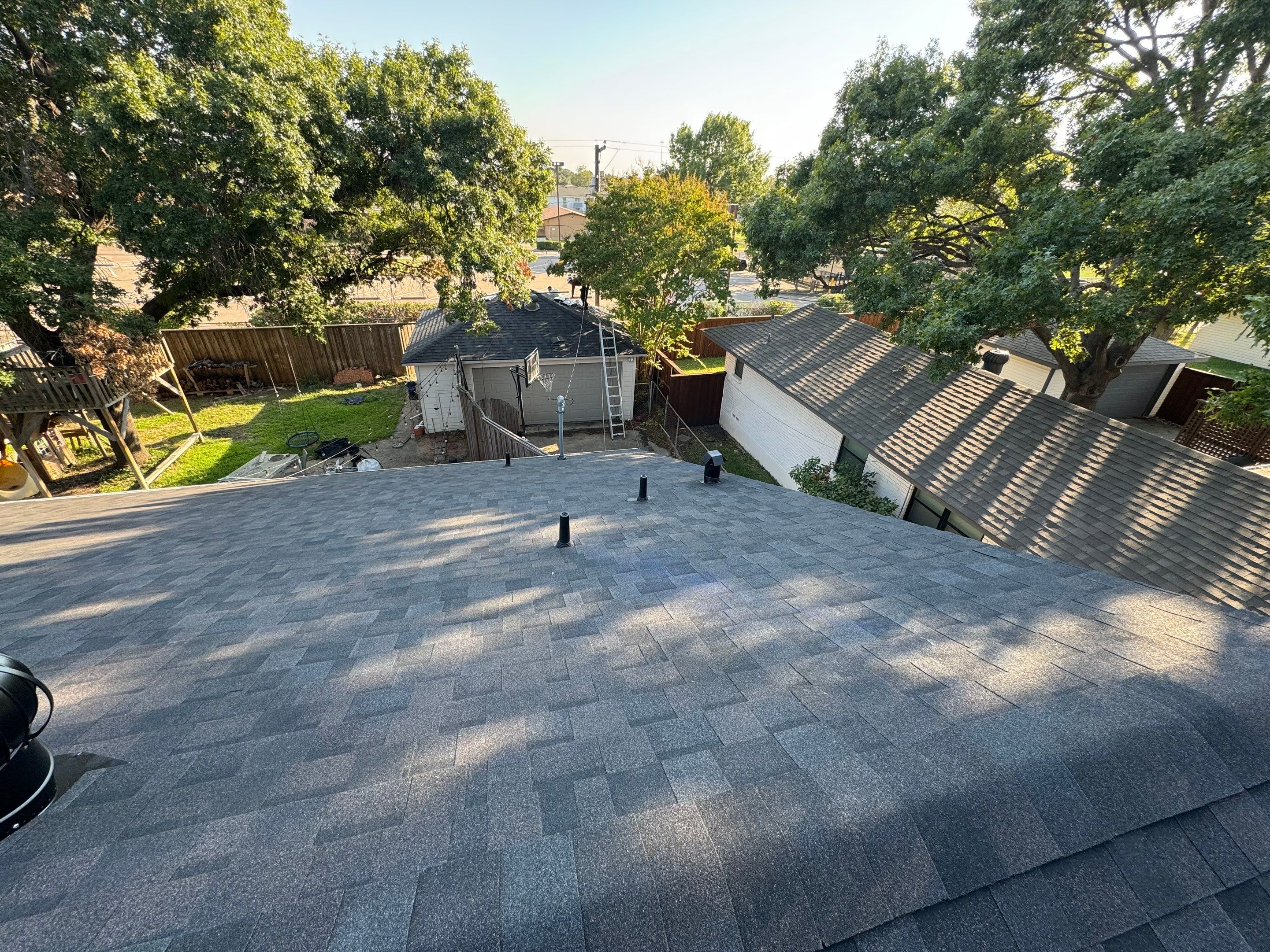 IKO Glacier-White brick house by Tejas Roofworks + Restoration