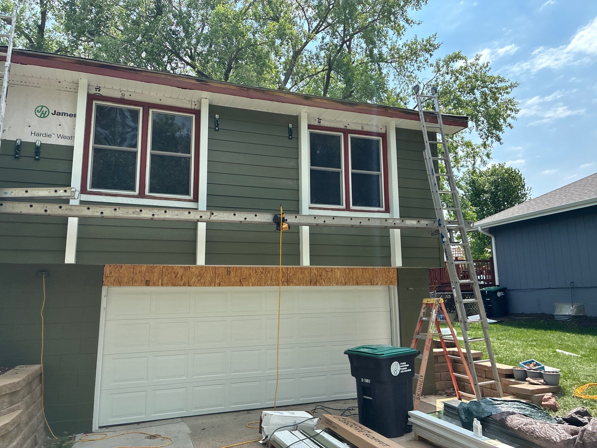 James Hardie Siding Replacement in Omaha with Mountain Sage Finish by Carps Complete Exteriors