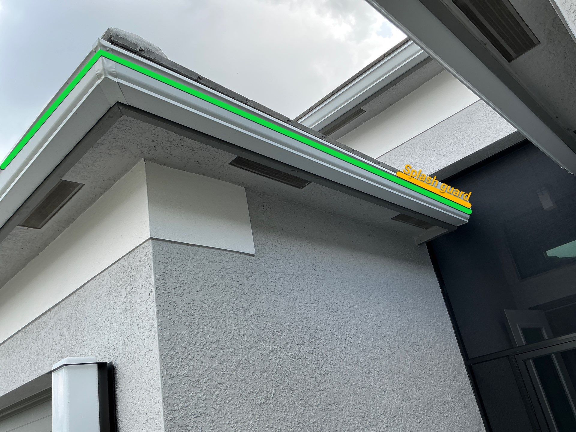 Grey Seamless Gutter Installation in Estero FL by Gutter Professors