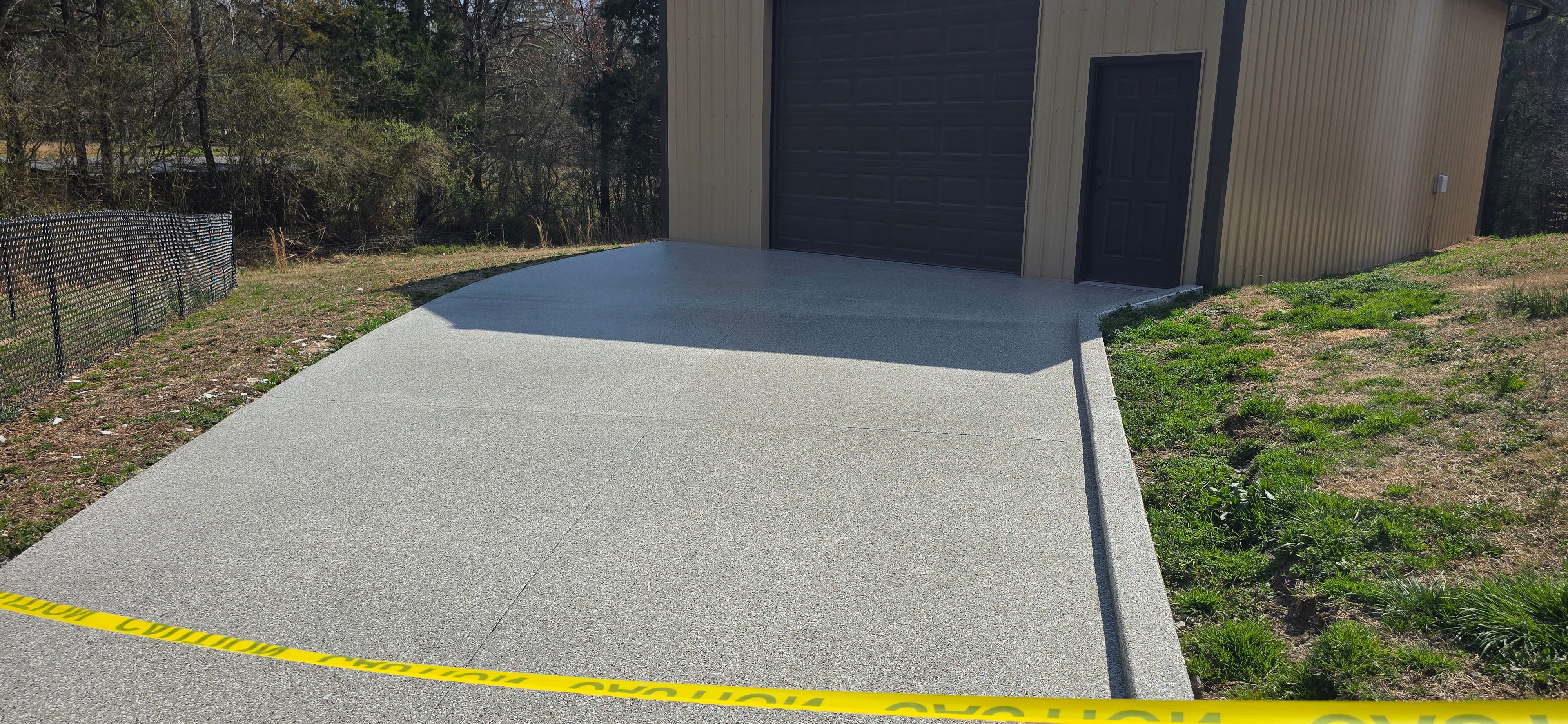 Driveway using Creekbed by Elite Floor Solutions