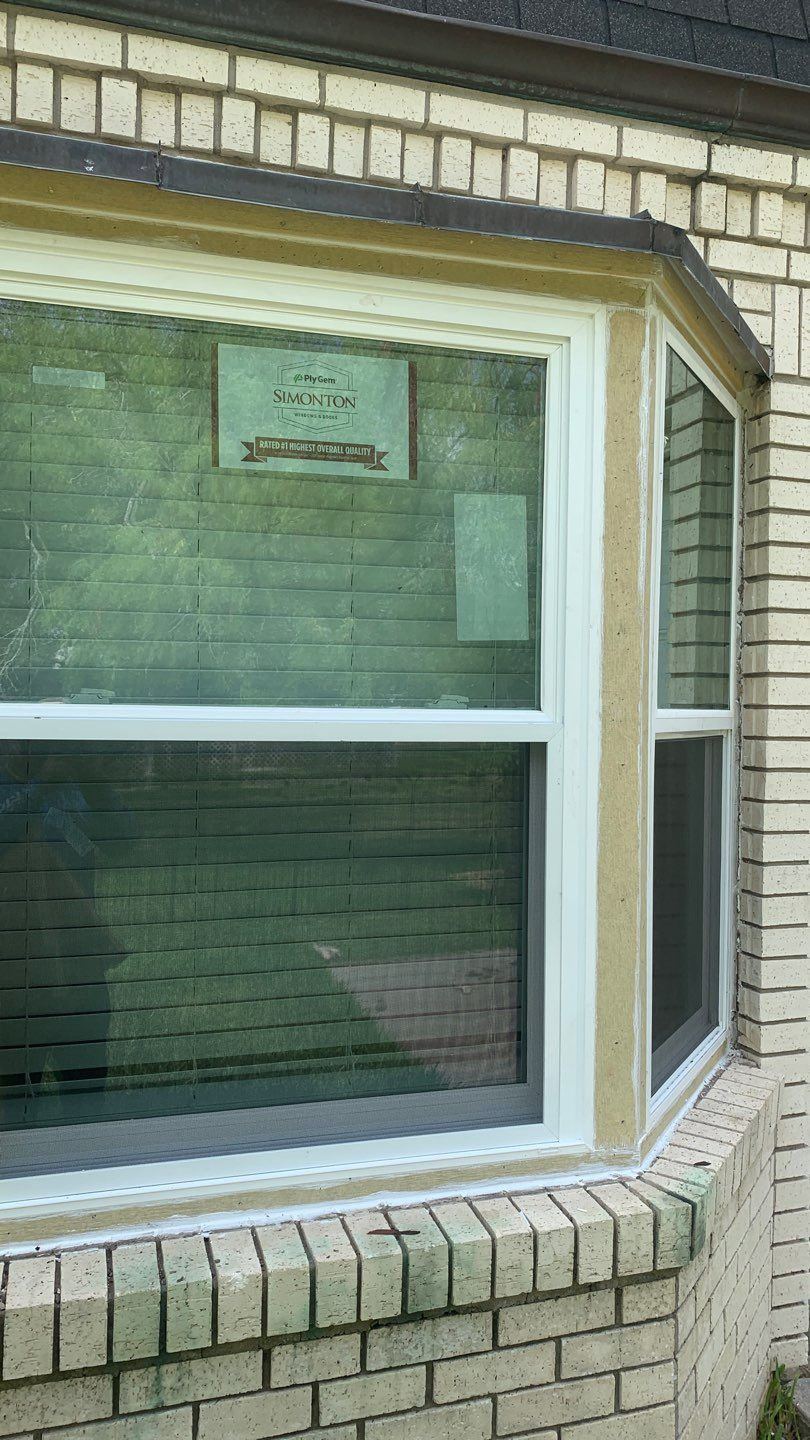 Mansard Charm by Bayfront Roofing and Construction