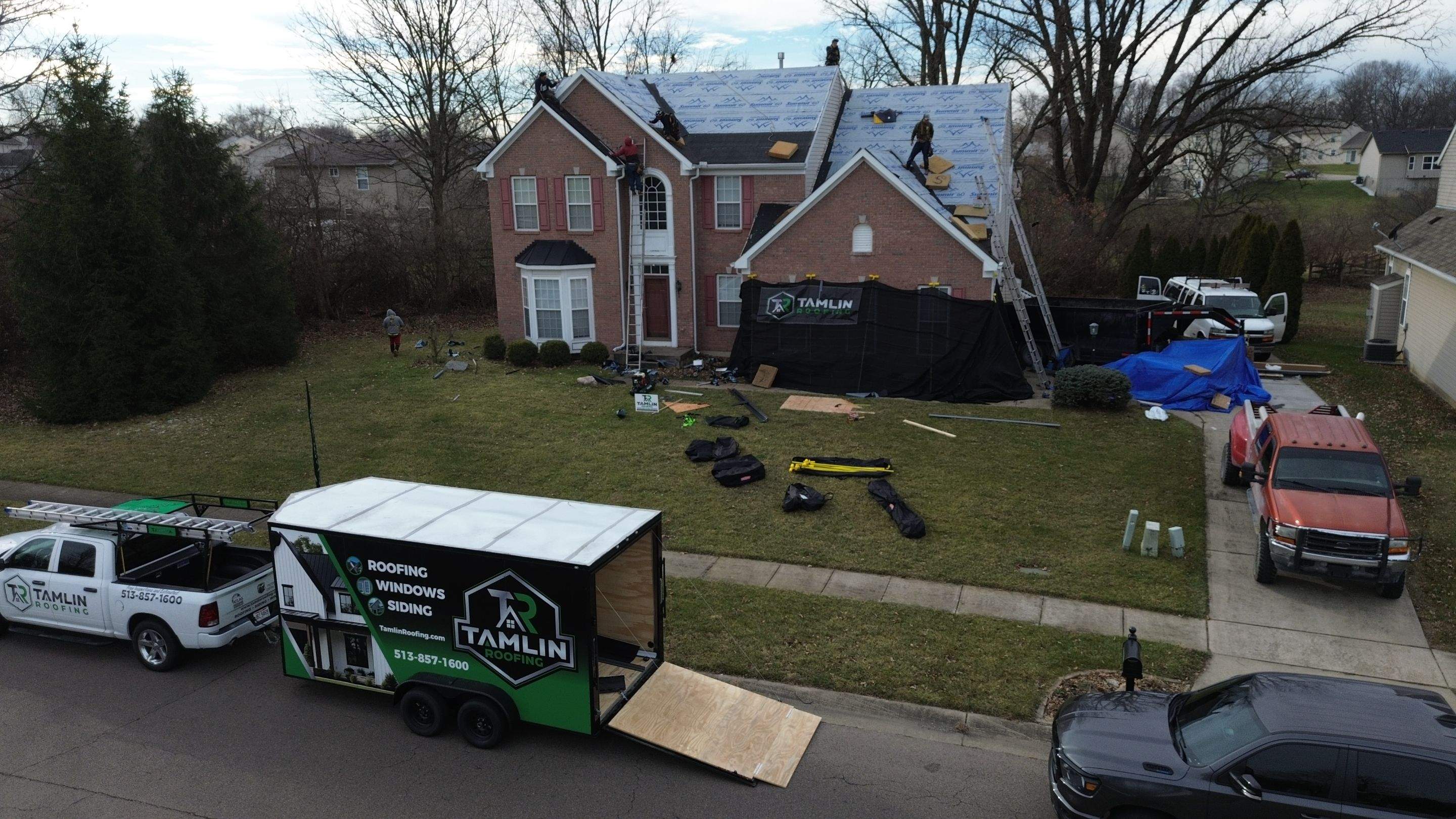 Walden Ponds - Pristine Black and Hydro Flo Gutter Guards by Tamlin Roofing