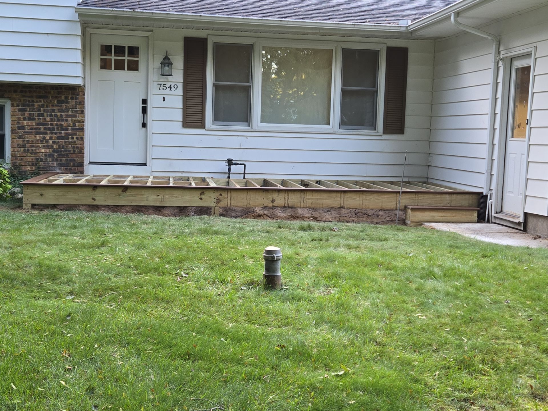 Exterior Remodel & Custom Deck by Cutting Edge Homes