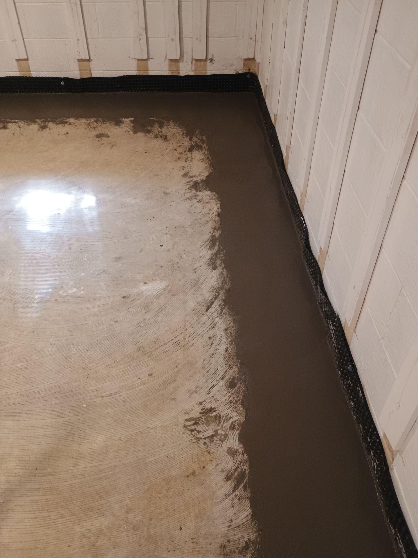 Interior Drain Tile & Buried Discharge in St. Anthony, MN by Waterproofing Northeast