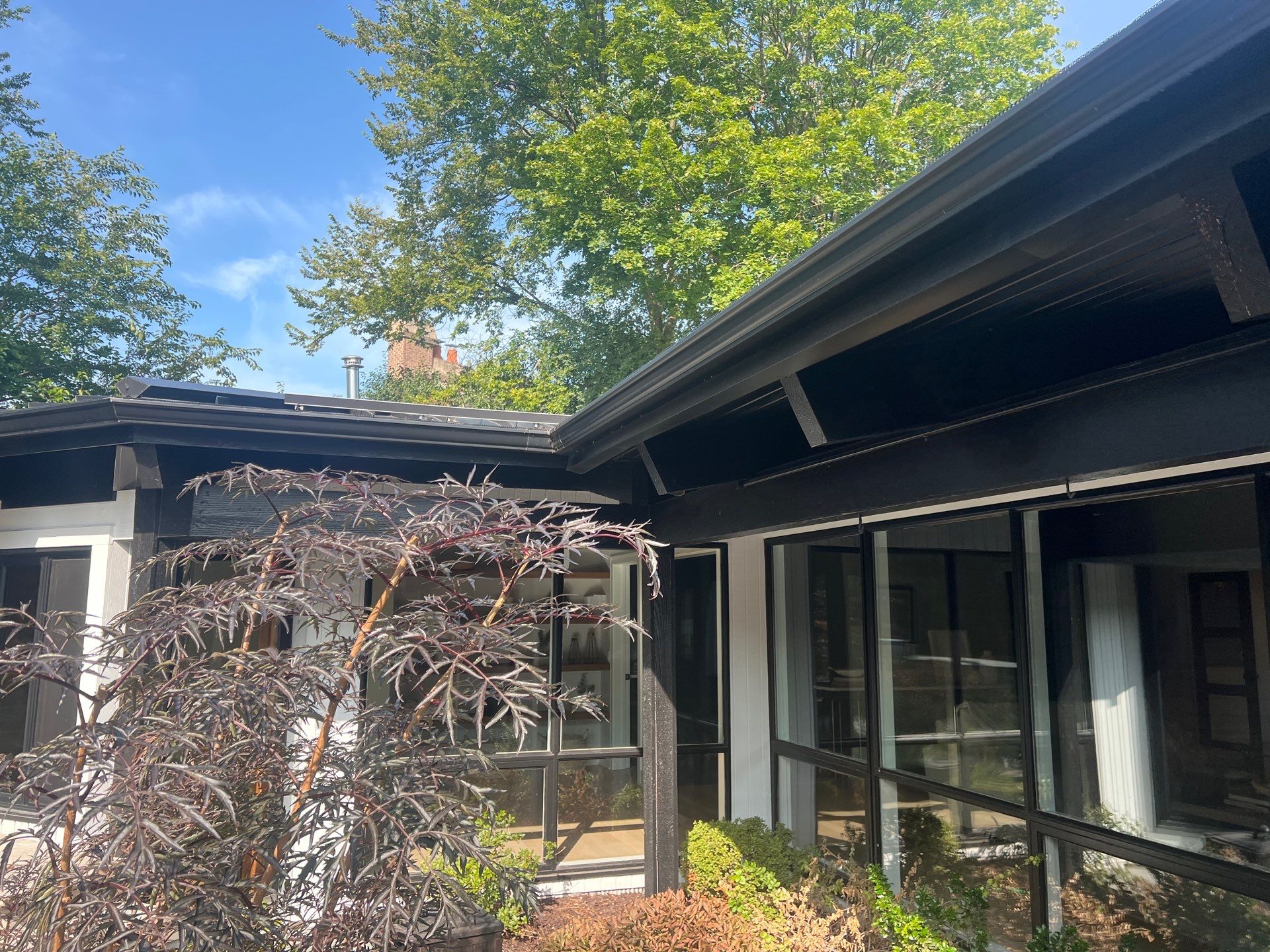 Complete Exterior House, Bluestone & Garage Floor Cleaning by Northern Power Washing LLC.