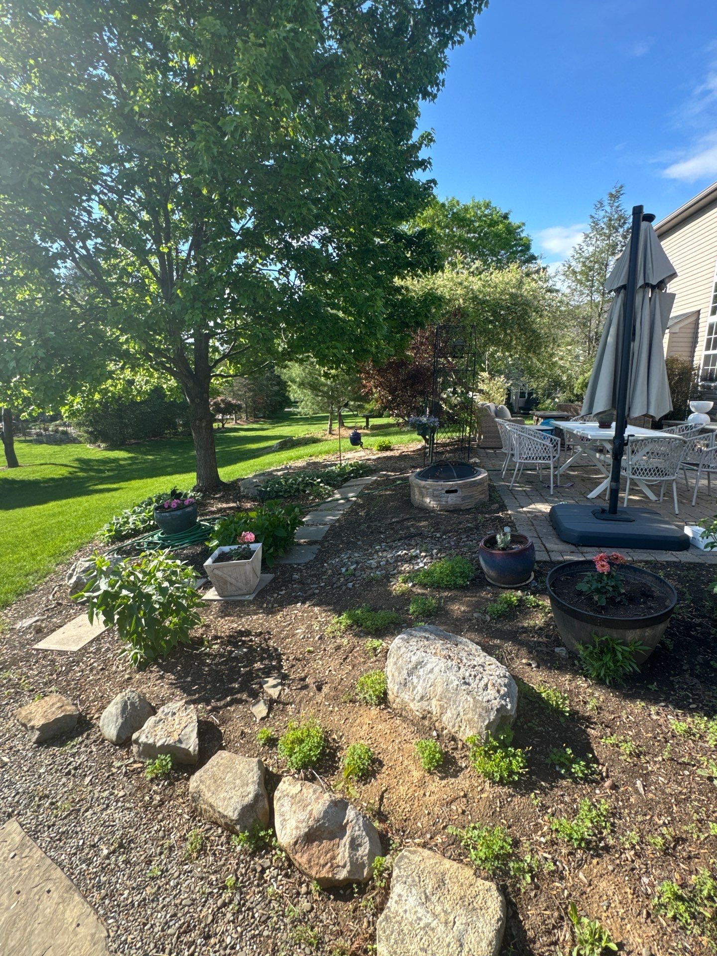 Backyard Retreat: Techo-Bloc Patio + Firepit Lounge by Saylor’s Lawn & Landscape