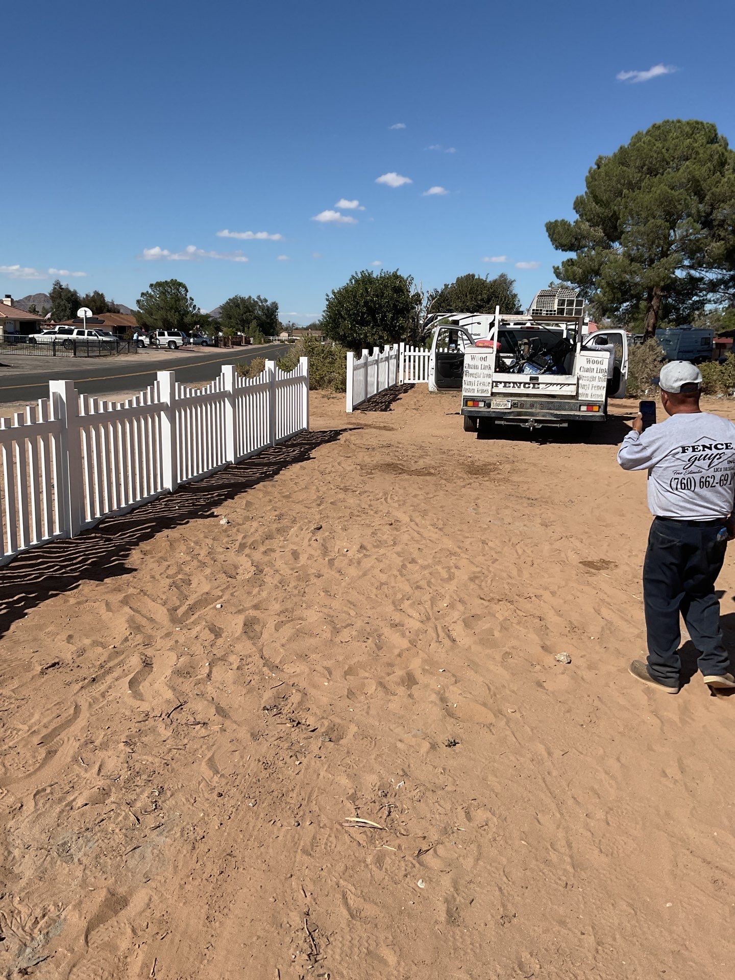 White picket fence  by Fence Guys Inc. 