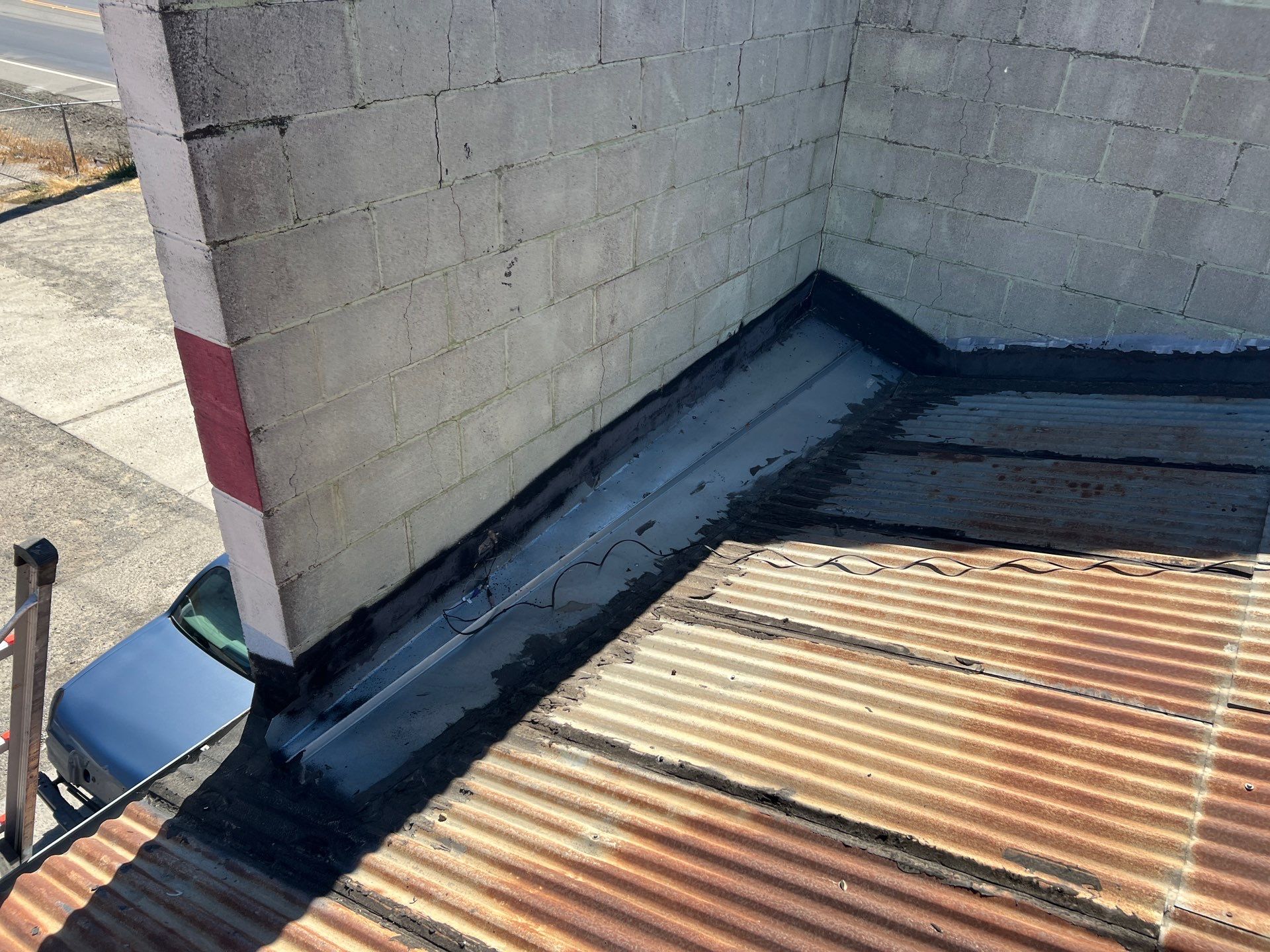 Spray foam and coatings using Conklin Benchmark/ PUMA XL acrylic coatings over metal and foam by Straight Edge Roofing Inc