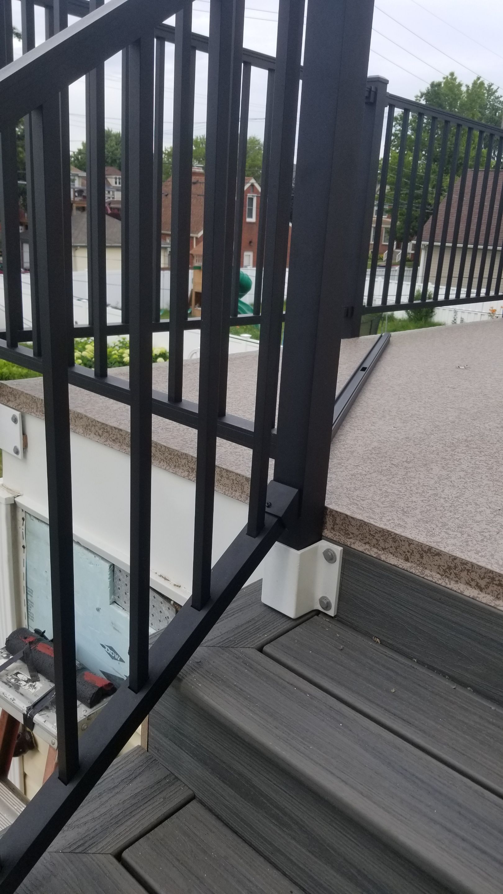 Rebuild balcony flat roofing TREX decking stairway and Railings in Wyandotte, MI by Northwest Construction 