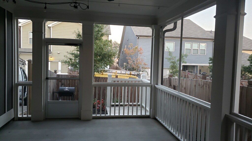 Custom Screened-In Porch Enclosure with White Railings in Smyrna by Swift Home Renovations