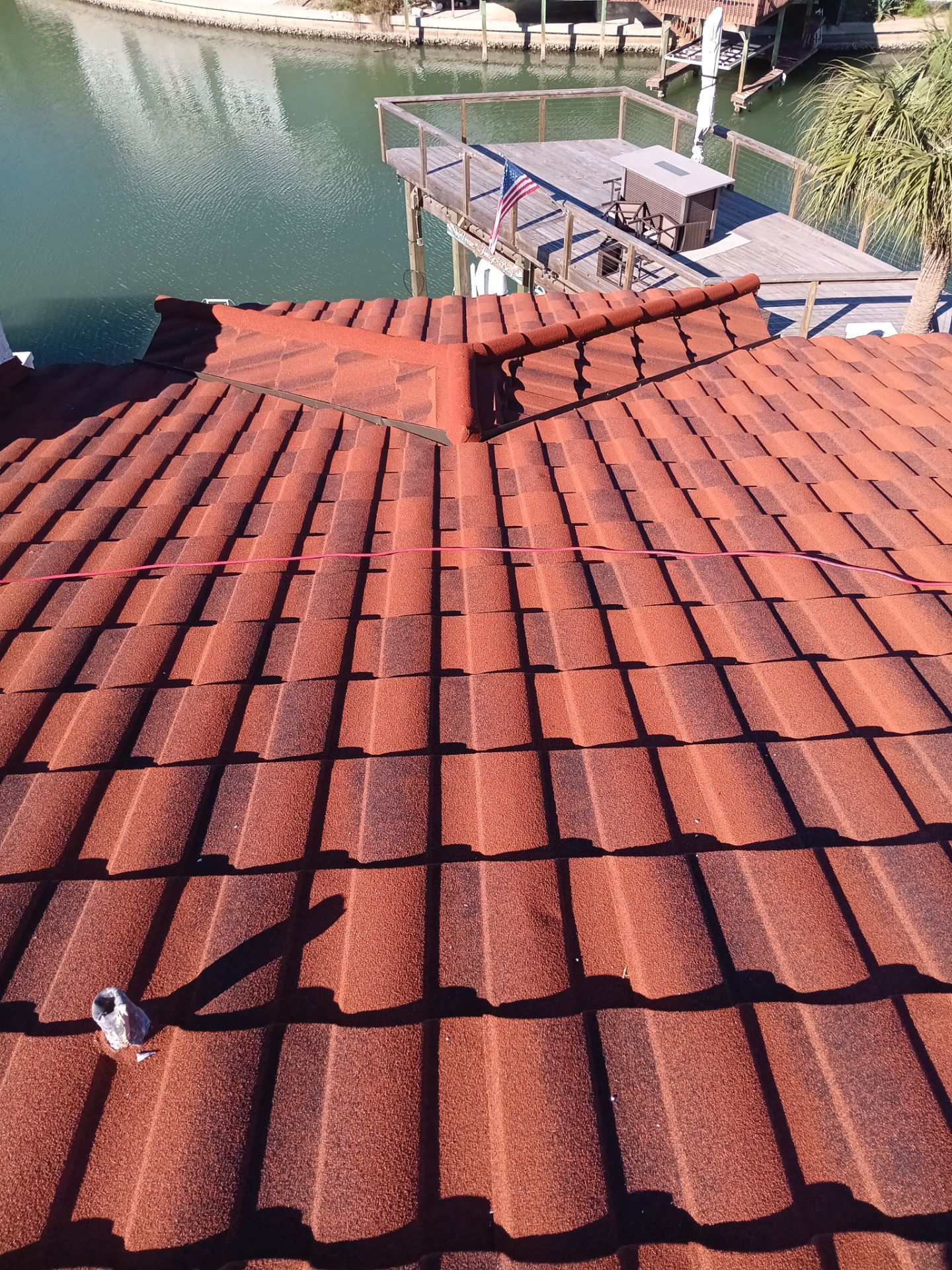 Off with the Tile and on with the TILCOR stone coated metal.  by Bayfront Roofing and Construction