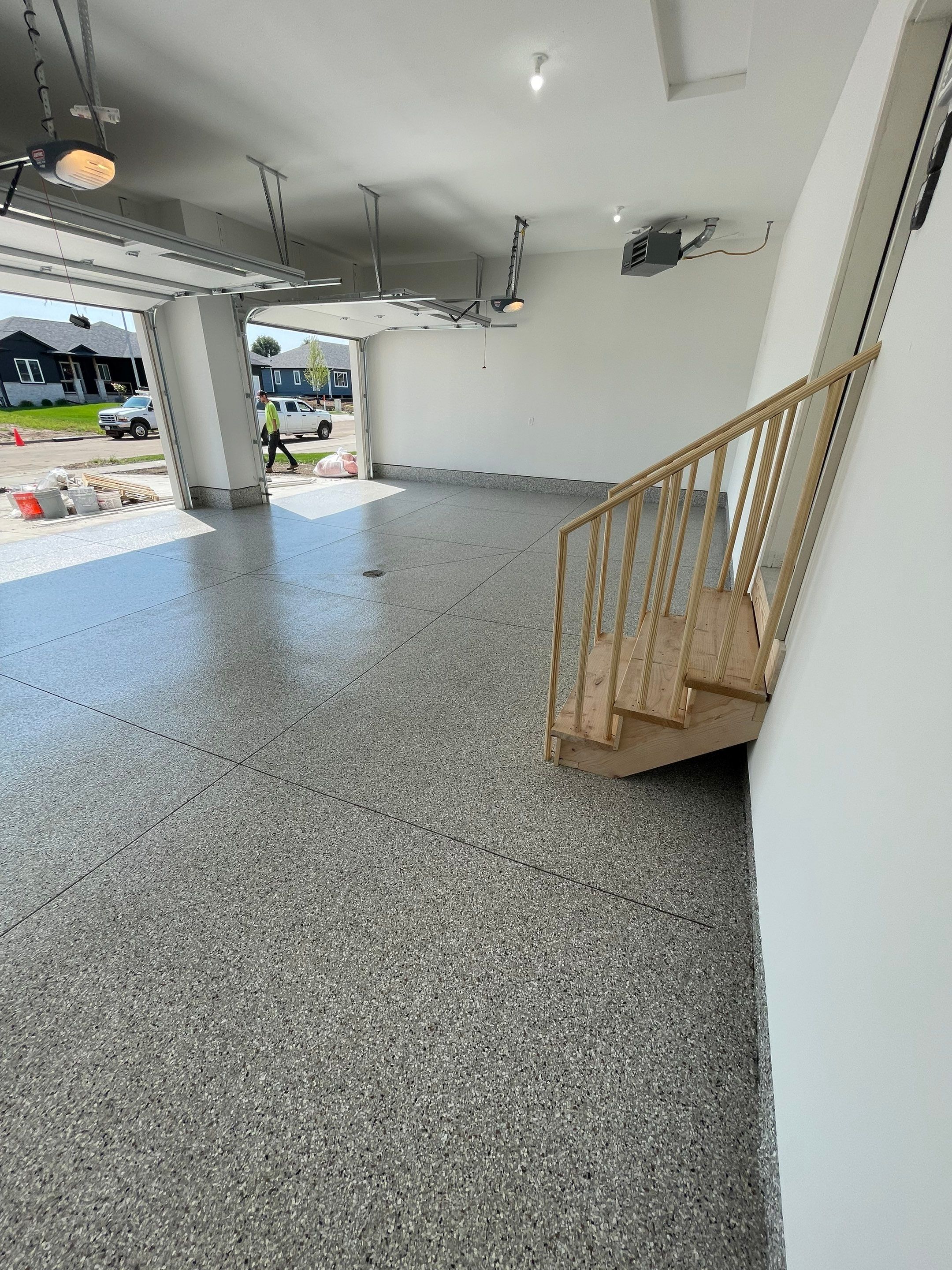 Grey Speckled Garage Floor Coating in Sioux Falls by Select Painting, Coatings & Garage Cabinets