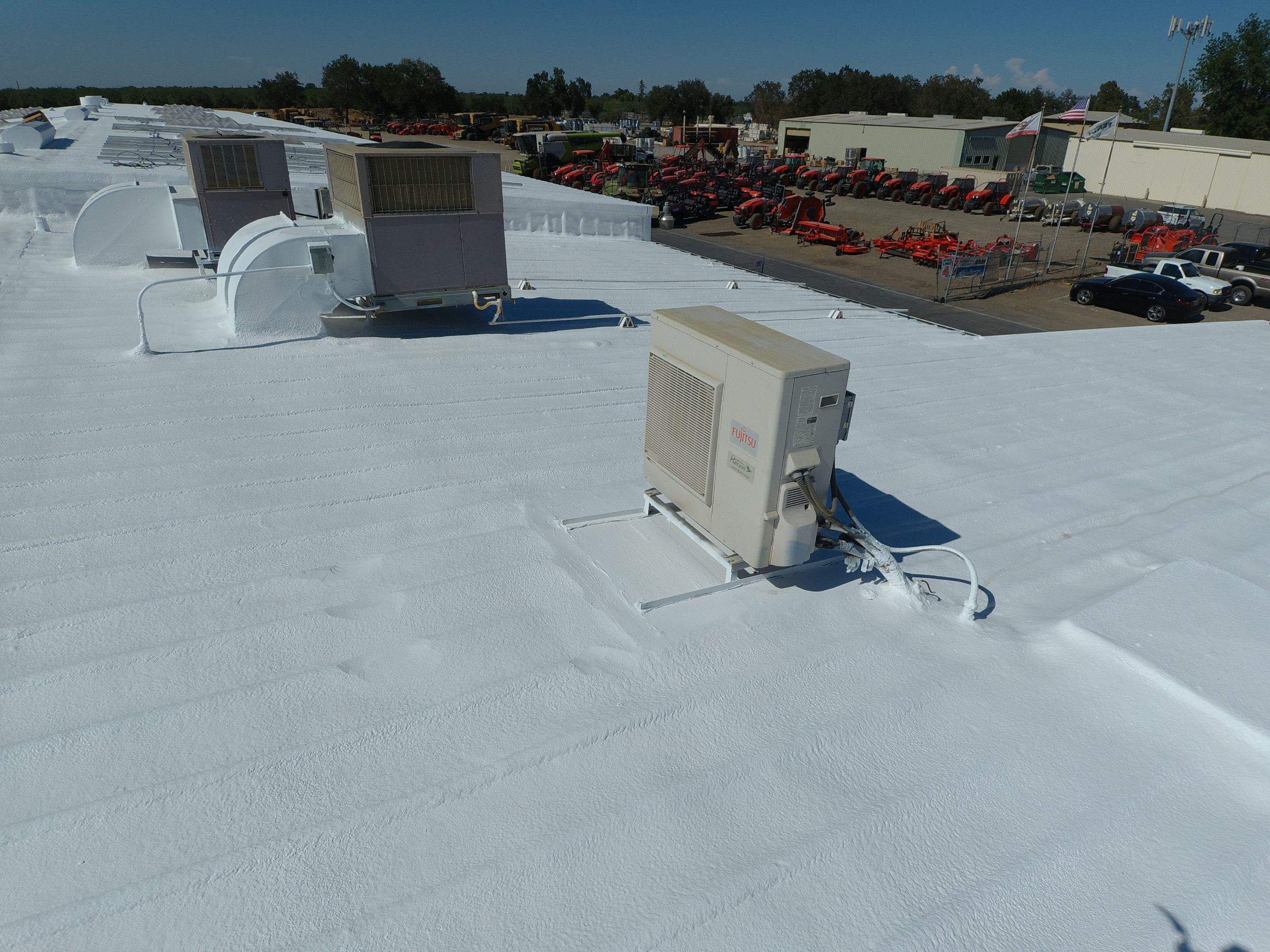 Spray foam and coatings using Conklin Benchmark/PUMA XL coatings and spray foam by Straight Edge Roofing Inc