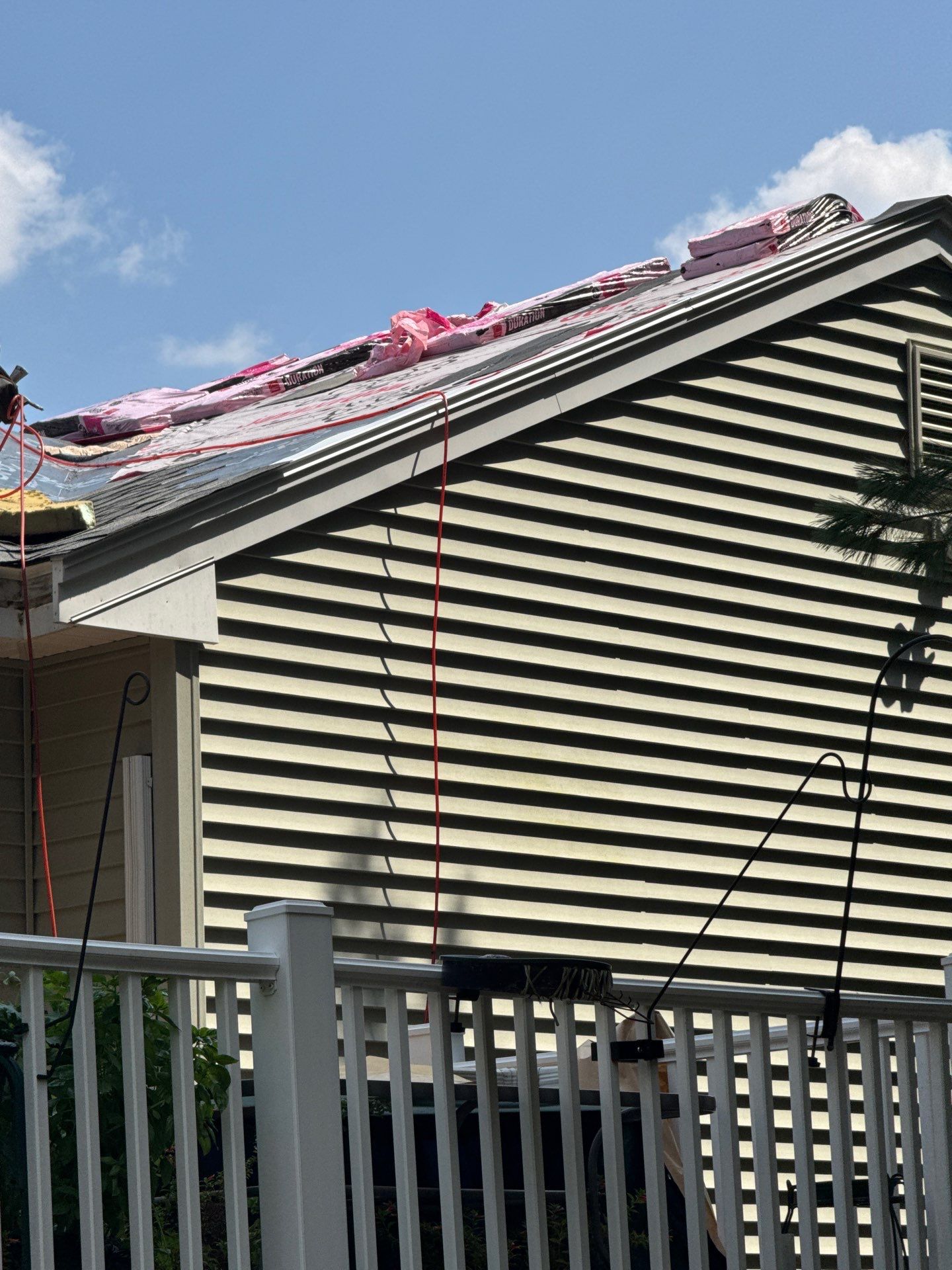 Complete Roof Replacement with Chimney Flashing, Gutter Guard System, and Vinyl Siding Repairs by Mighty Dog Roofing of Greater Middlesex County