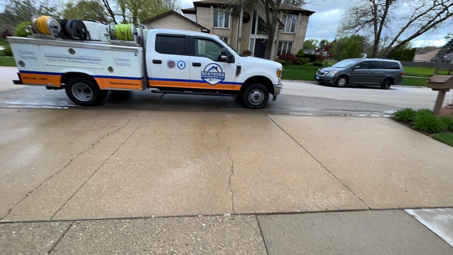 concrete patio and driveway cleaning by Northern Power Washing LLC.