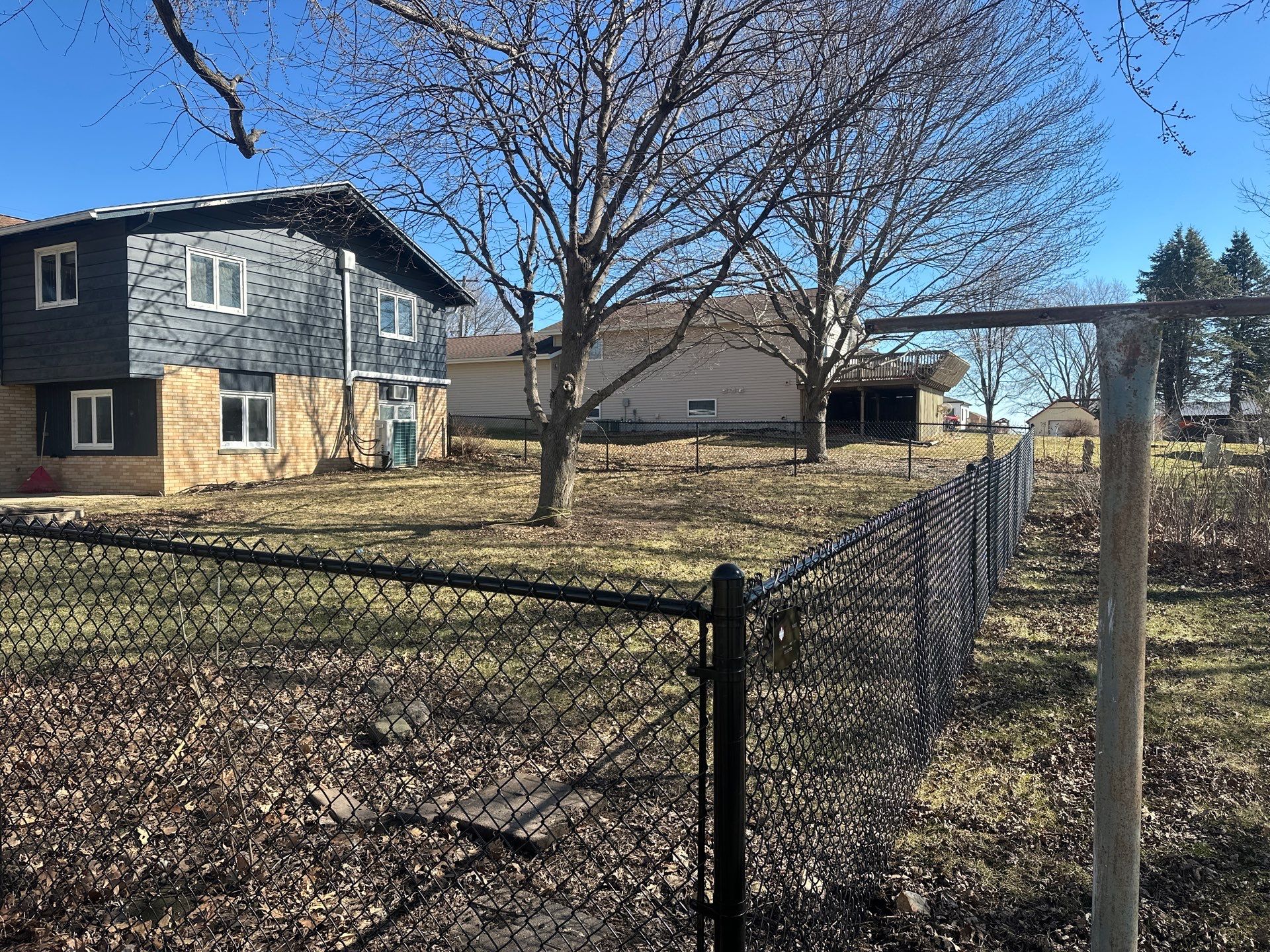 Black Chain Link Fence Installation with Double Gate in Grundy Center by Perfect Picket Fence and Stain