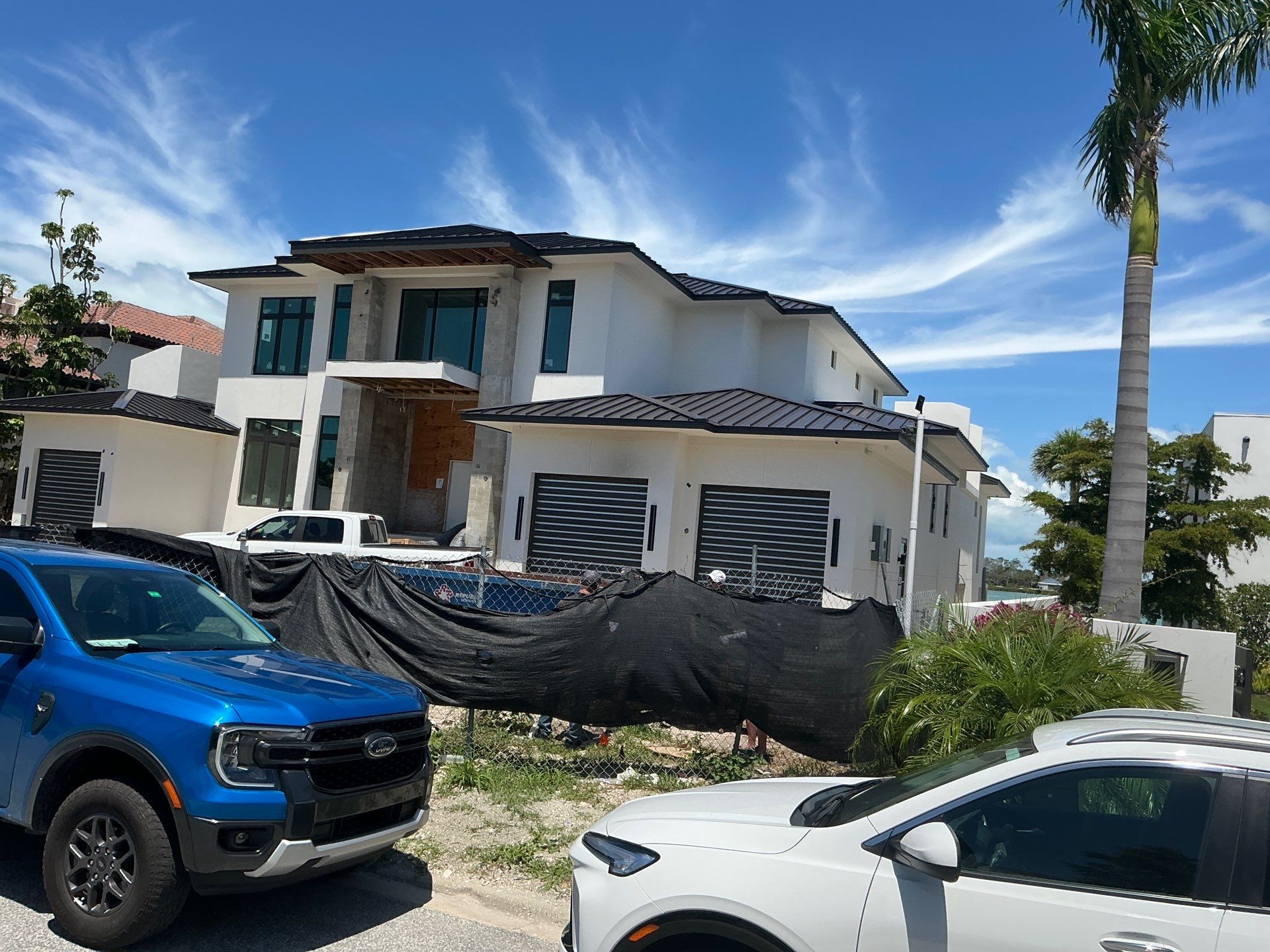 Seamless Aluminum Gutter Installation using black seamless gutters in Sarasota FL by Gutter Professors