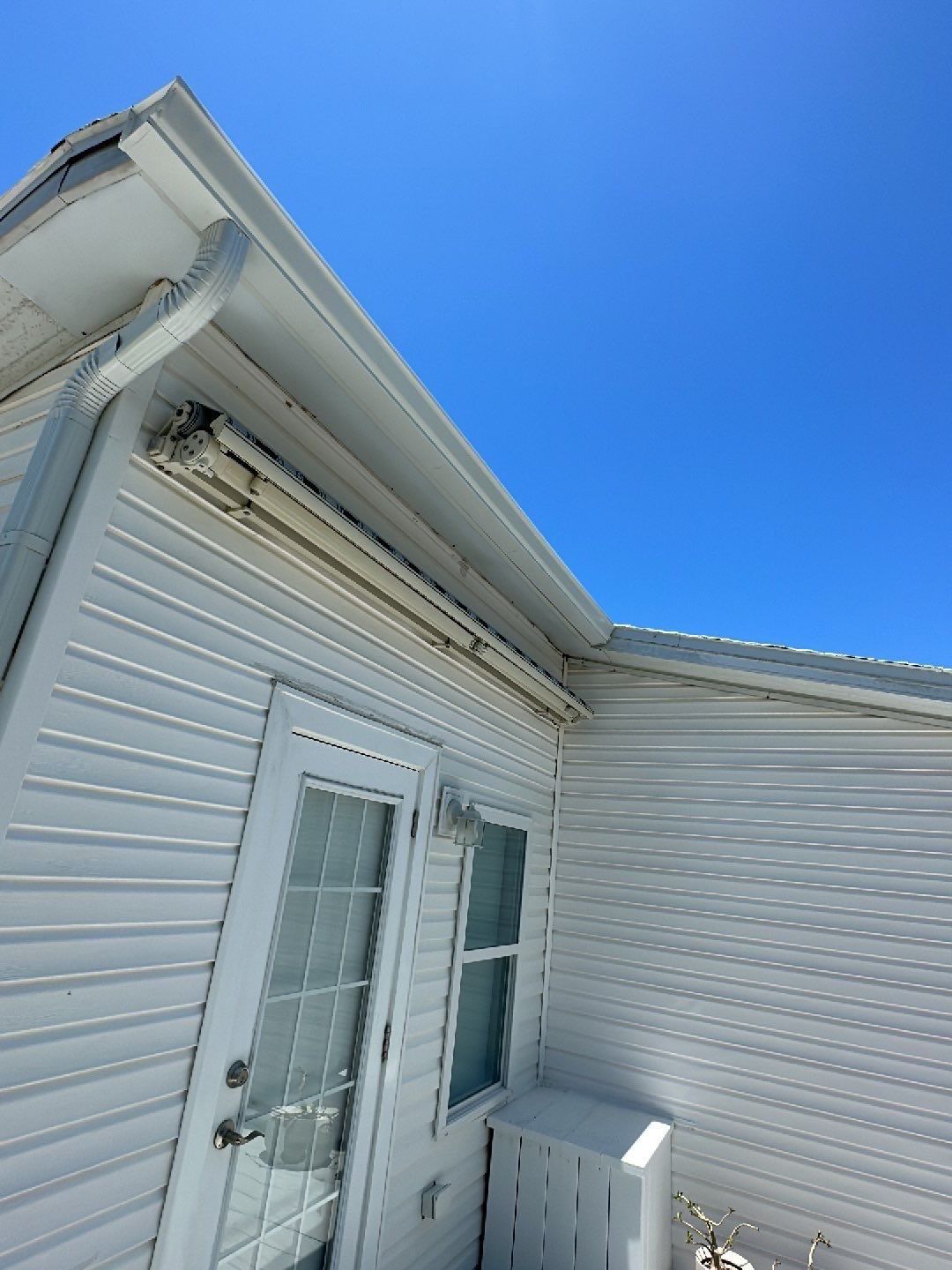Downspout Installation using Charcoal Grey in Sanibel FL by Gutter Professors
