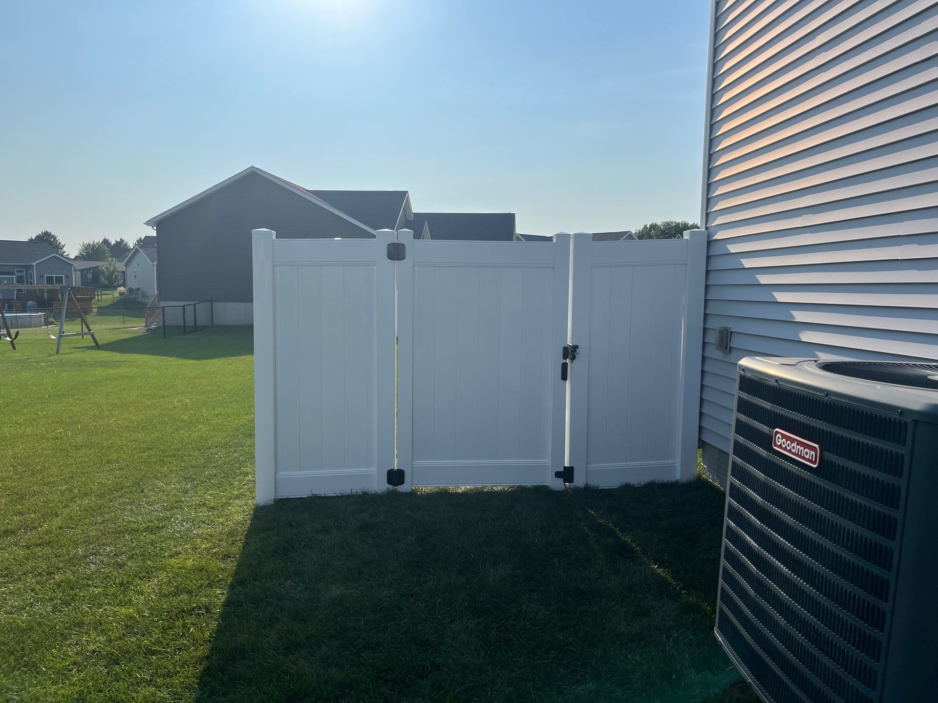White Vinyl Privacy Fence Installation With Double Gates in Waterloo by Perfect Picket Fence and Stain