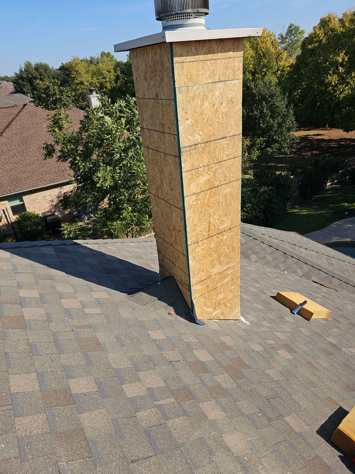 chimney repair using lap engineered treated composite siding. by road roofing llc