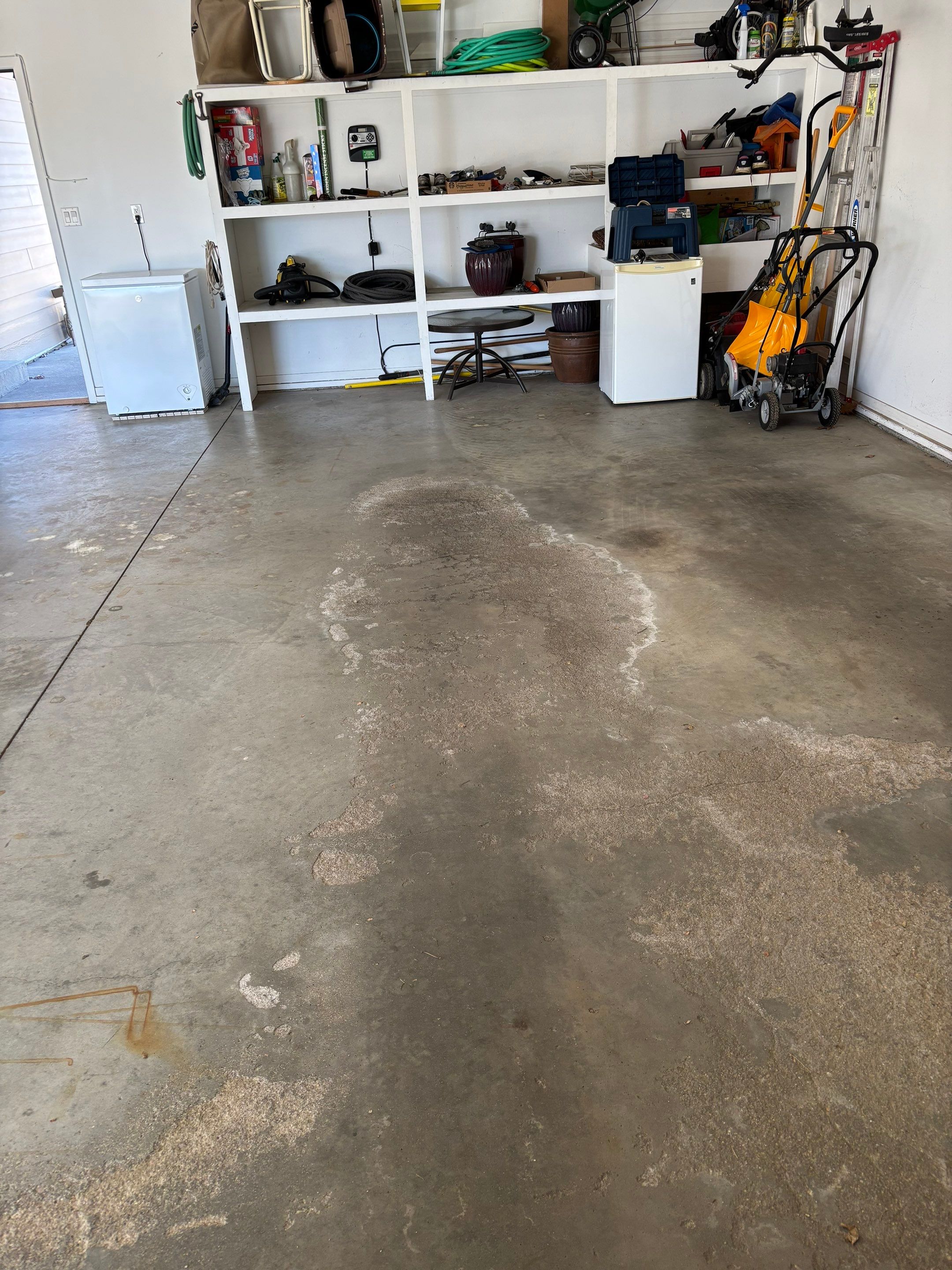 Yankton Garage Floor Restoration with Gray Speckled Epoxy Coating by Select Painting, Coatings & Garage Cabinets