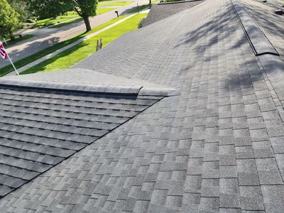 Installing new Roof, Fascia, Soffit, and Gutters. New custom trim around garage door.