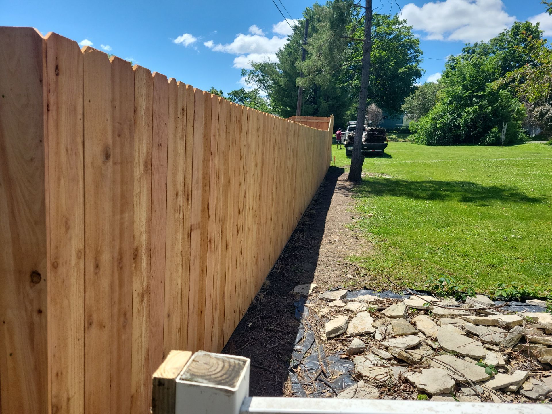 Custom Cedar Unstained Wood Privacy Fence Installation in Cedar Falls by Perfect Picket Fence and Stain