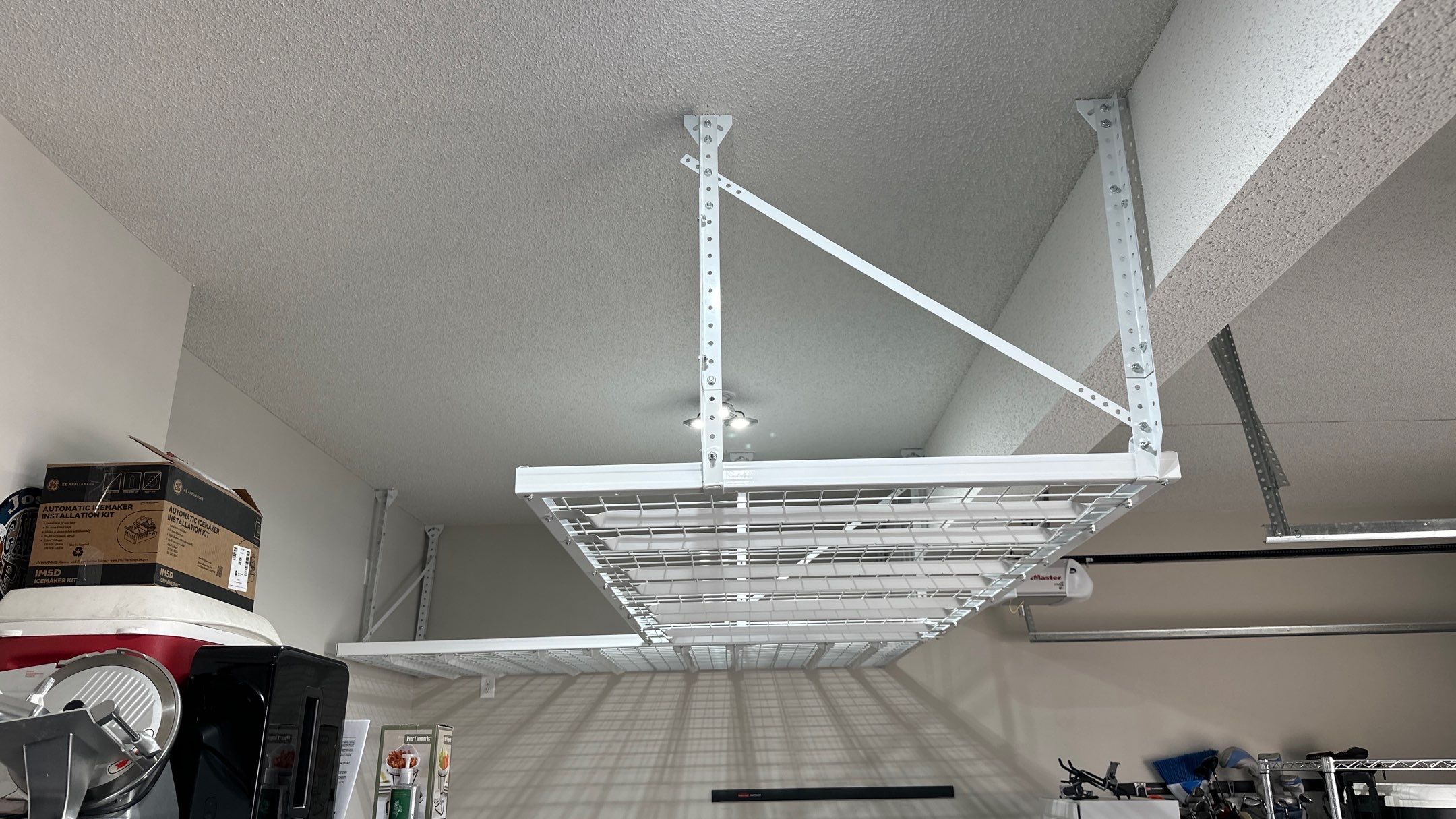 Josh H. Upgraded his storage with overhead racks by Banner Garage