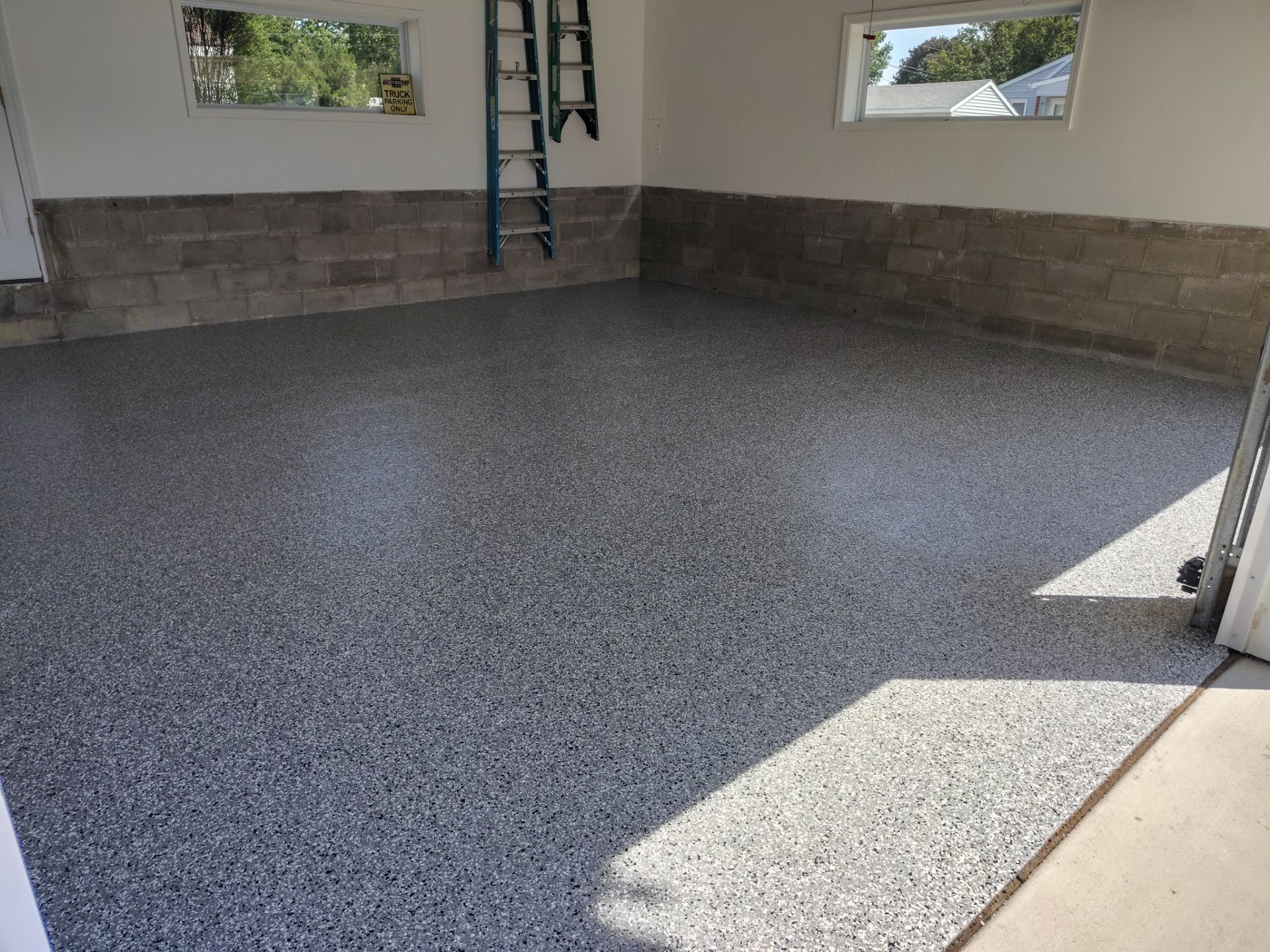 Wombat Flake Garage Floor Coating in Perry, IA by Revival Concrete Coatings