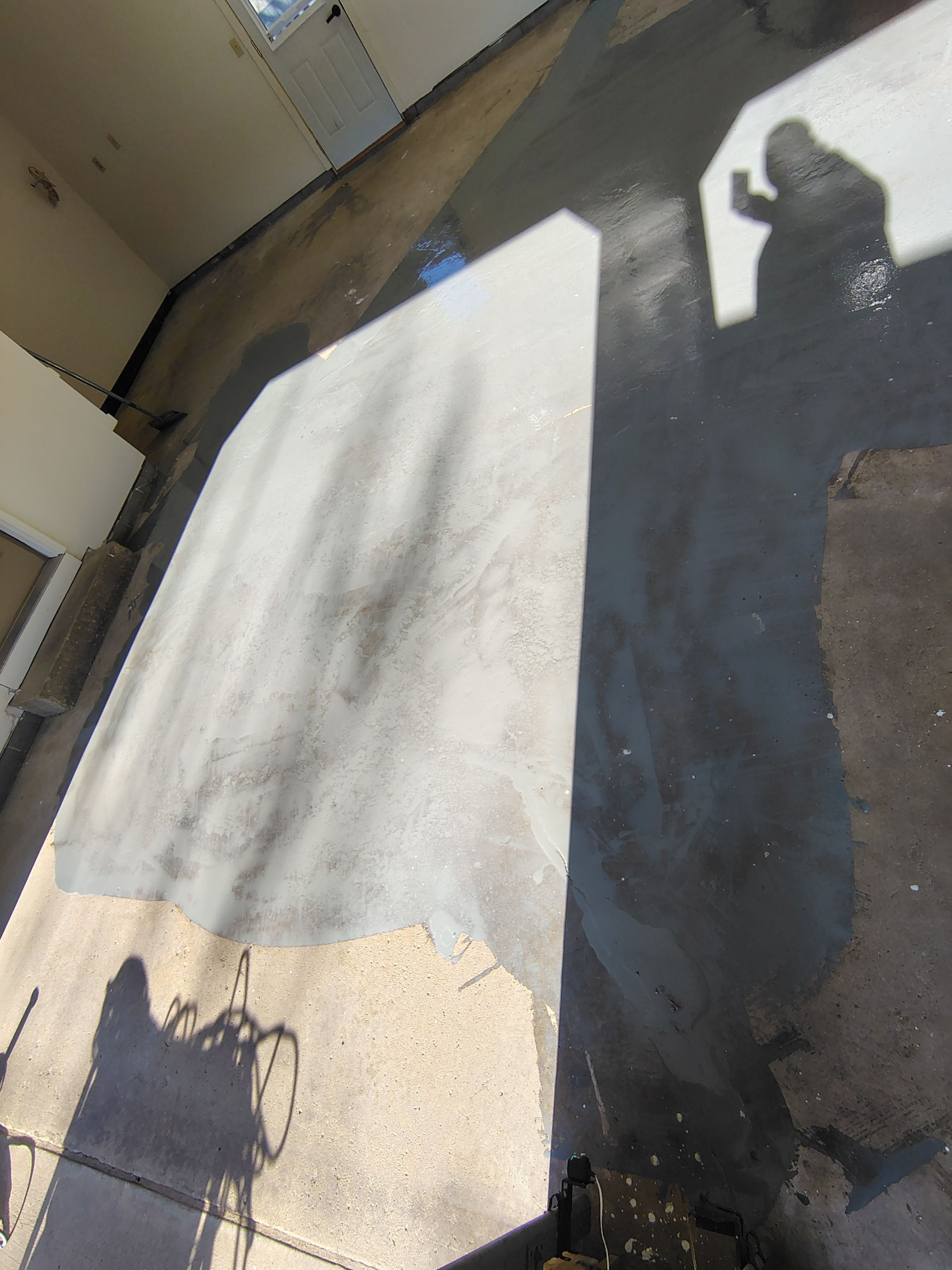 Full-Flake Epoxy Garage Floor Coating Installation in Sioux Falls by Select Painting, Coatings & Garage Cabinets