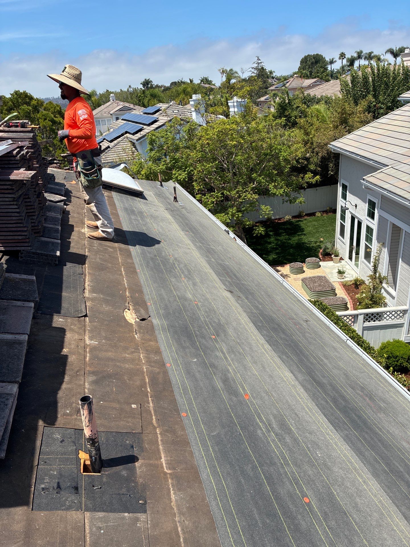 Carlsbad Concrete Tile Roof Replacement with Copper Flashing and Skylights by Reliable Roofing San Diego Inc.