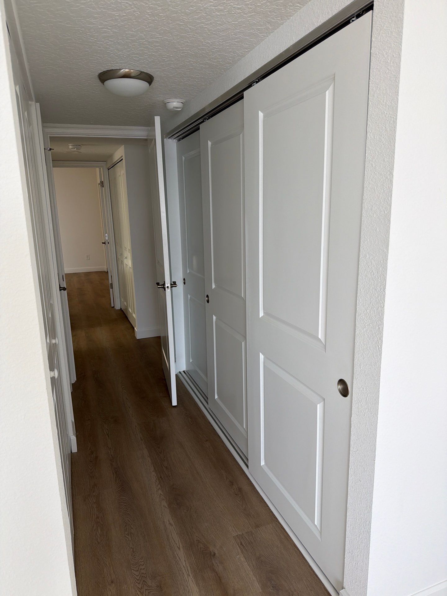 Full Condominium Remodel Featuring Aubrey Oak Flooring In Daytona Beach by Acies Renovations