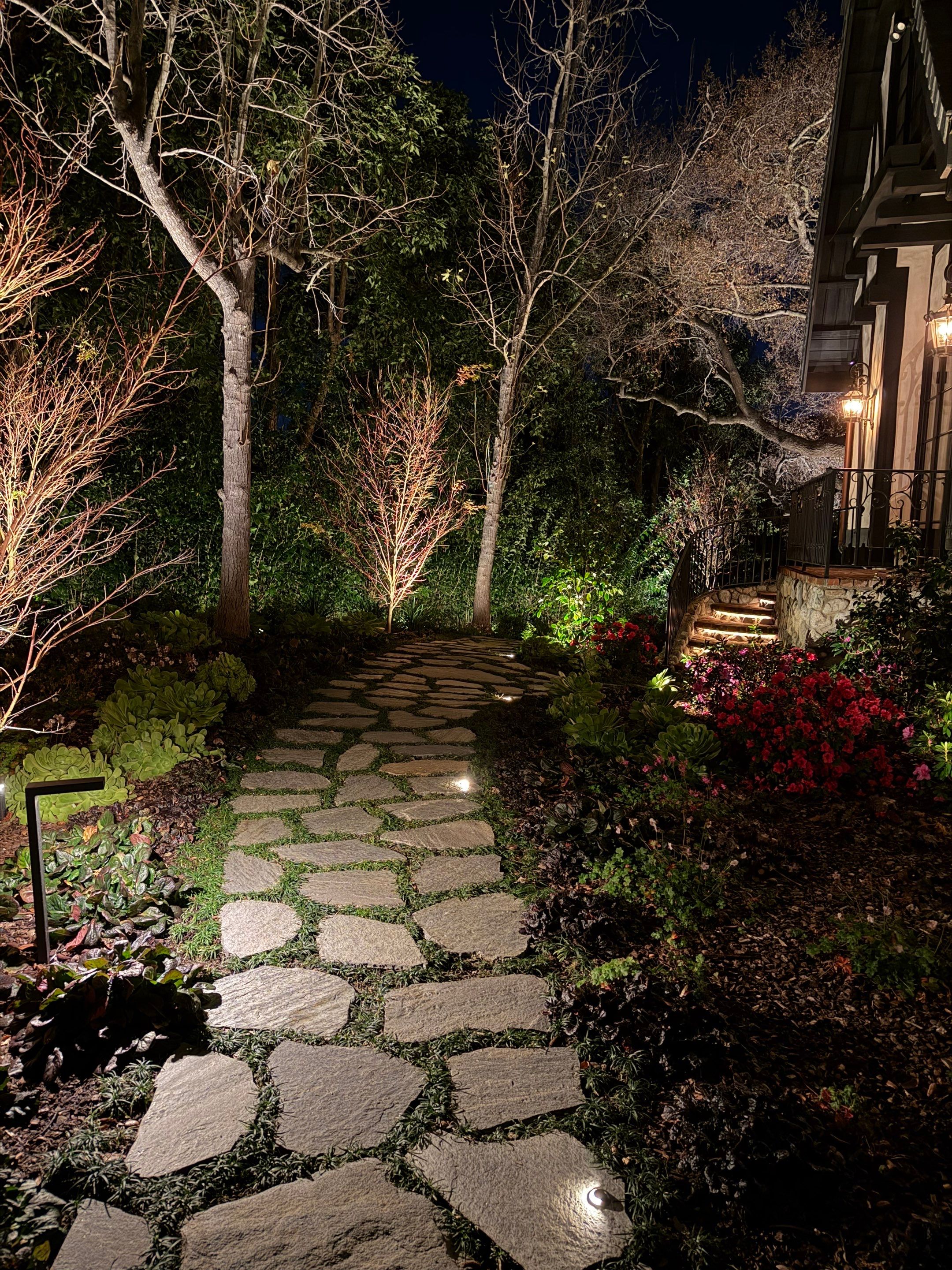 Tudor Estate Landscape Lighting with Integrated Stone Step Illumination by Outdoor Lights + Shades