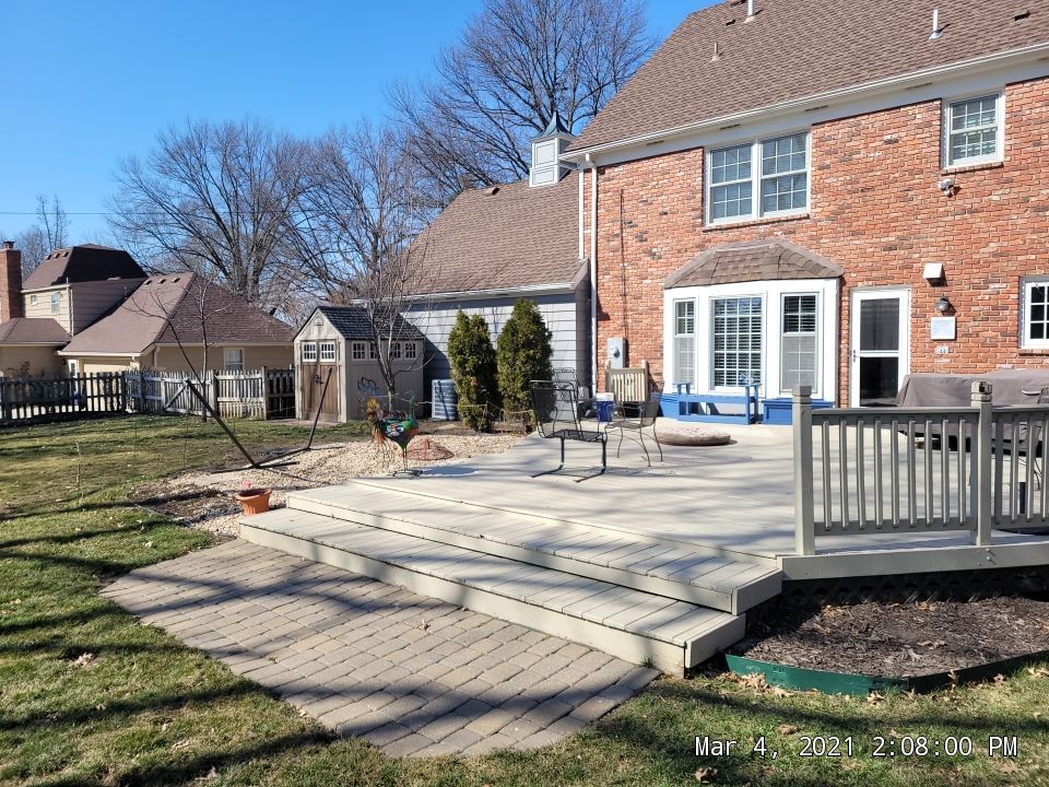 Back Yard Stamped Patio by LAND ESCAPES LLC