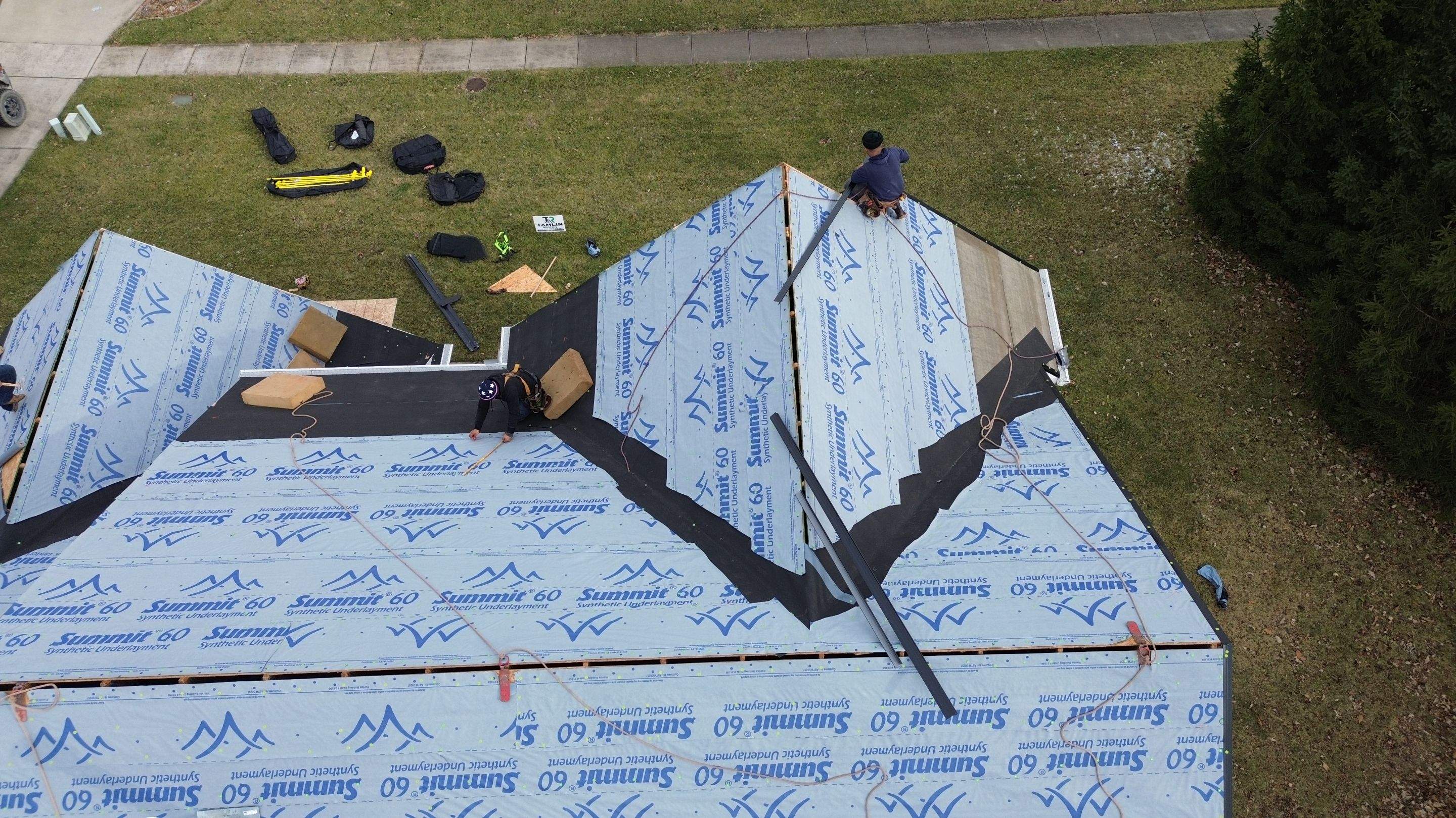 Walden Ponds - Pristine Black and Hydro Flo Gutter Guards by Tamlin Roofing