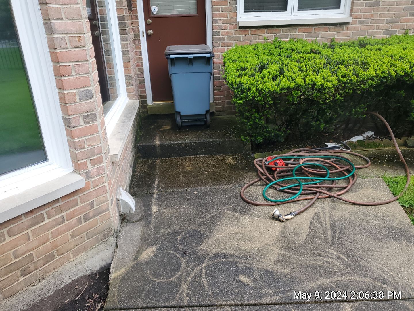 concrete patio, retaining wall, awning cleaning by Northern Power Washing LLC.