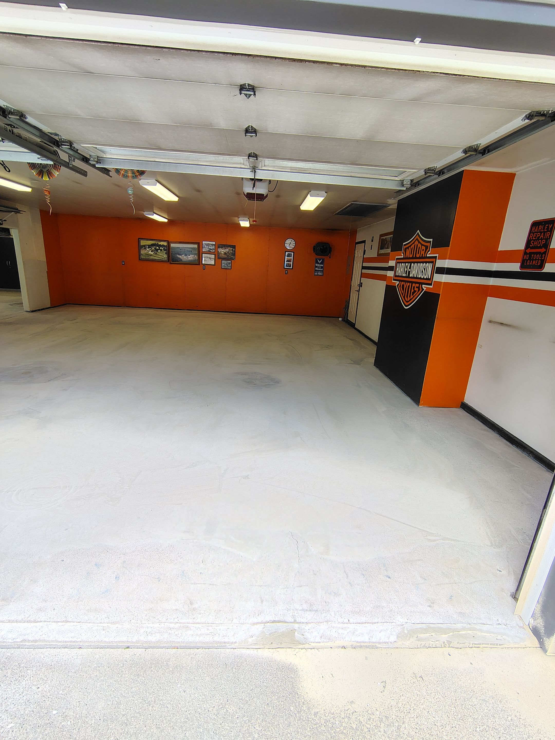 Custom Grey Flake Epoxy Garage Floor Installation in Remsen by Select Painting, Coatings & Garage Cabinets