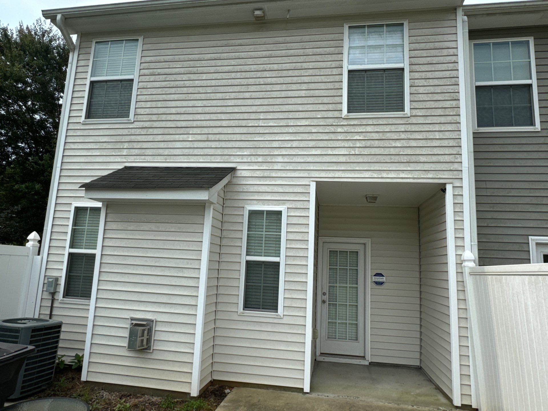 exterior house cleaning pressure washing siding dirt removal on vinyl panels