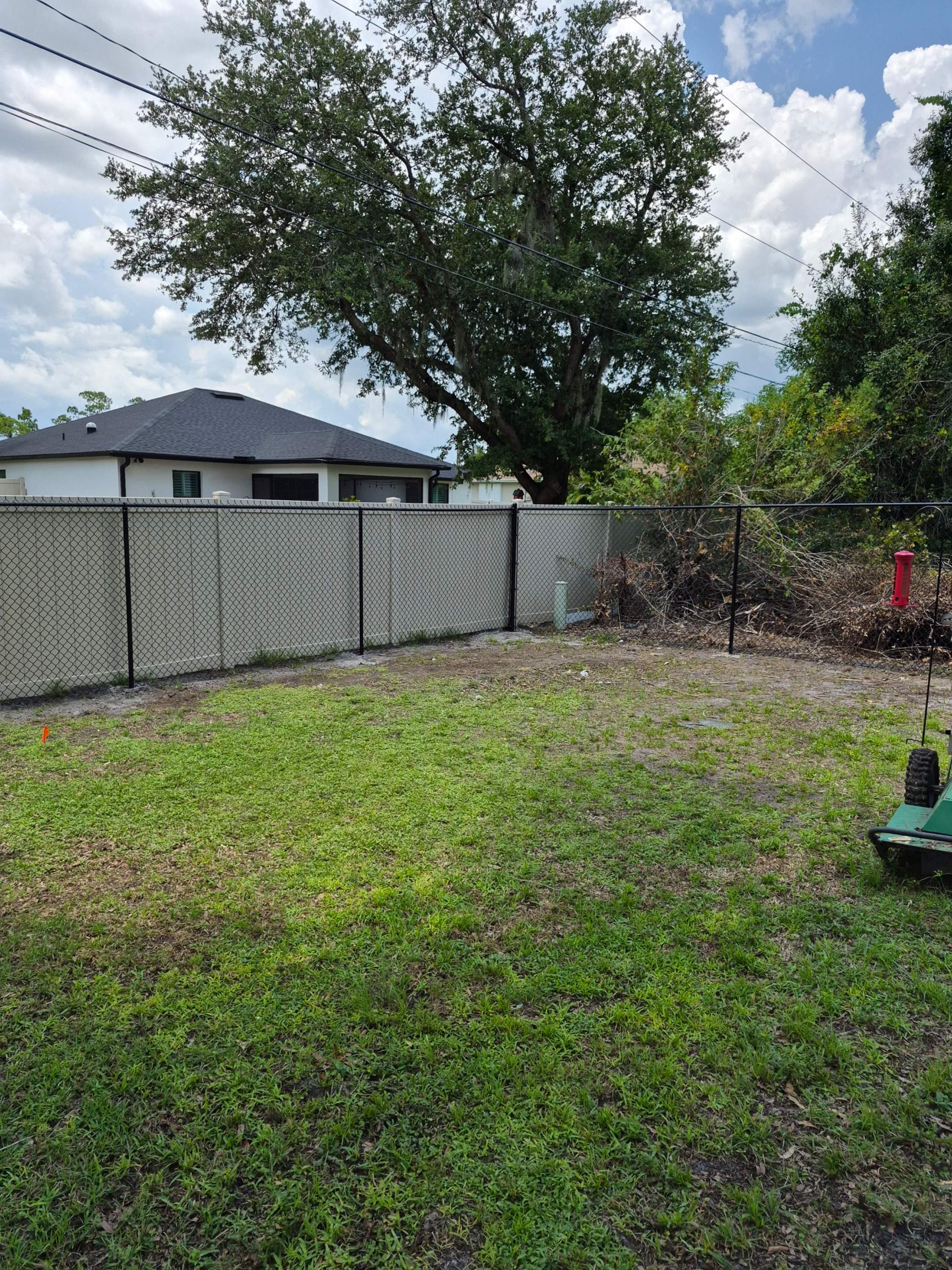 Black Chain Link Perimeter Fencing with Double Gates in Port Charlotte by True Fence LLC