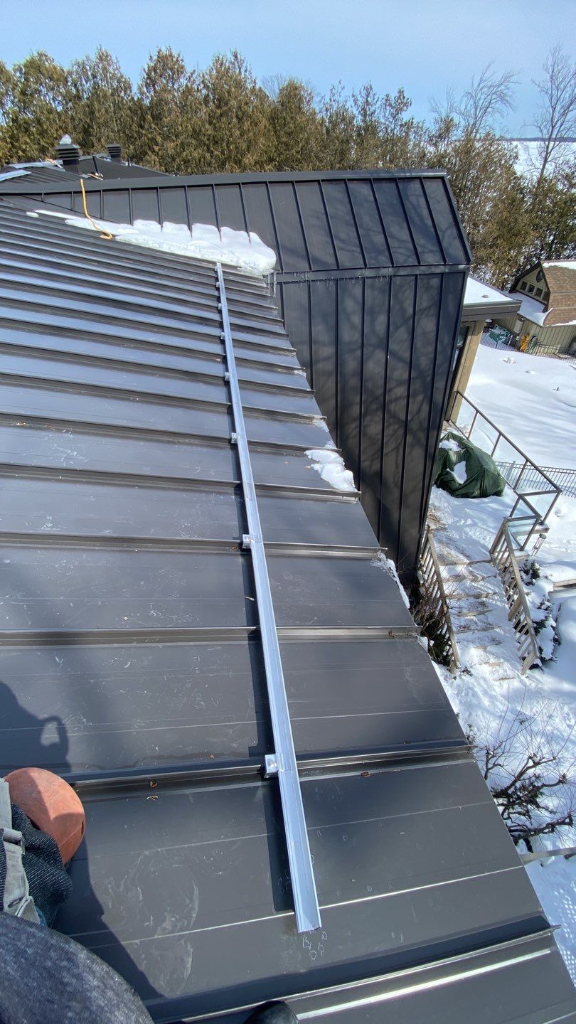 Residential Roofing Installation using 16" Standing Seam Panels by Jay Carter Roofing & Sheet Metal
